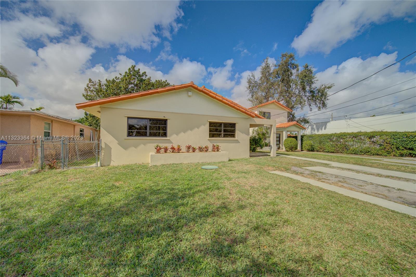 Ideal family home centrally located in the heart of Miami. Encompassing 1,622 sqft of living space, this gem is ready for a new family. The open-concept kitchen with views to the backyard offers brand-new SS Samsung refrigerator, stove, and dishwasher. Pristine white quartz countertops with bar sitting finish this space.The spacious tiled dining, living, and family room are perfect for entertaining in comfort.The bedrooms feature wood laminate flooring and ample closet space. Brand new vanities in the bathrooms.This pet-friendly home also offers a fully fenced backyard with a large avocado tree providing shade and breeze.A laundry room with a built-in sink and extra storage complete the home. Live in close proximity to the Airport, Flager st, Calle Ocho, Magic Casino, and Coral Gables.