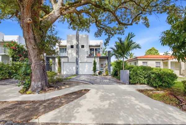 Built in 2021, this modern 3-bedroom, 2.5-bath townhouse is ideally located between Coral Gables and Coconut Grove. Features include impact windows and doors, porcelain tile flooring, high ceilings, smart-home technology, and an open-concept layout. The kitchen offers custom cabinetry, a hidden pantry, stainless steel appliances, and a snack bar. French doors lead to a private fenced backyard with travertine, artificial turf, and a covered pergola. Upstairs features spacious bedrooms with walk-in closets, automated blinds, and balconies. Additional highlights include a 1-car garage, driveway parking for 2+ vehicles, EV charging station, and no HOA approval required. Conveniently located near shopping, dining, major highways, and top-rated schools. Showing property Wednesdays 6:30pm-8pm and Saturdays 1pm-3pm by appointment ONLY- 24 hrs. notice pls.