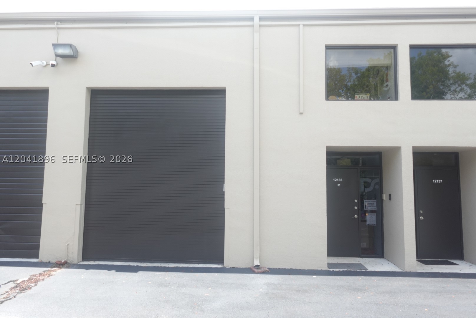 Fully built-out warehouse with loft space ideal for office use, showroom, or additional workspace. Centrally located in Kendall near Tamiami Airport, this versatile unit features a convenient first-floor entrance and approximately 800+ sq. ft. of usable space, including the built-out loft area. Upgrades include, new bay door (12 ft. clearance), new flooring throughout non-warehouse space, and partially upgraded electrical. Enjoy excellent accessibility with close proximity to major expressways, making it a great option for businesses seeking a functional and well-connected location.
