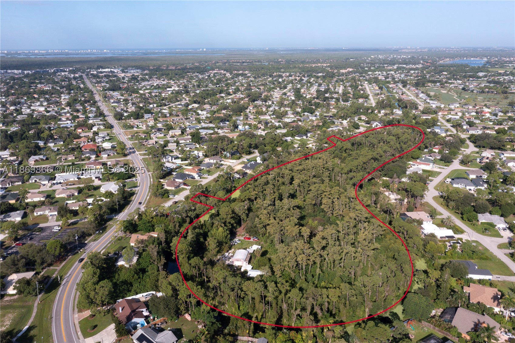 Discover a rare opportunity to own nearly 15 acres of prime land in Fort Myers, perfectly situated within the city yet offering a private, natural retreat. This offering includes three contiguous vacant lots being sold together, providing two access points for convenience and flexibility. The site is rich with Florida’s native flora, including mature trees and the iconic Dahoon Holly, and serves as a sanctuary for local wildlife. A recent survey shows only 0.66 of the property is wetlands and an environmental survey delineates minimal mitigation for full use of the 15 acres. While remnants of previous structures, including an in-ground pool, spa, guest bungalow, carport, and gazebo, remain, the land is a blank canvas for new construction or creative development.