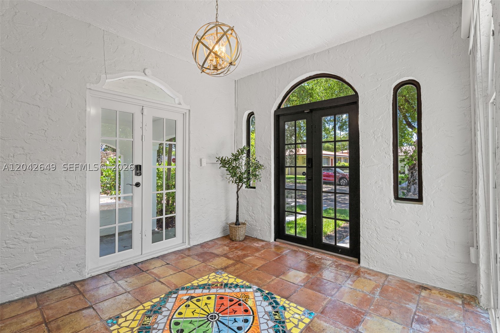 Rare opportunity to own a fully updated historic home with modern systems already in place. This Old Spanish home combines timeless architecture, flexible living space, and extensive upgrades. Nestled on a picturesque tree-lined street in the sought-after Granada neighborhood, this move-in-ready home offers the perfect blend of historic character and peace of mind. Original architectural details include a classic barrel tile roof, arched entryways, hardwood floors, and elegant Mediterranean-inspired design. The main residence features 3 bed rooms, 2 baths, a renovated kitchen, with a bright, functional floor plan filled with natural light. Extensive capital improvements include a NEW roof (2026), PGT hurricane impact windows and doors, Carrier HVAC system, updated electrical, new plumbing including copper water line from the street, water heater, newer septic tank, sprinkler system, and custom window treatments. Not designated "Historical" making it easy to add a half bath to the exiting home or expand the home for a larger layout. Plus, it offers a detached air-conditioned Casita, which adds approximately 200 sqft of flexible space, ideal for a home office, guest suite, fitness studio, or a creative workspace. Add a bathroom there and you'll have a detached living space great for guests or in-laws quarters. Located just minutes from Granada Golf Course, Miracle Mile, downtown Coral Gables, top-rated schools, dining, shopping, parks, and major commuter routes.