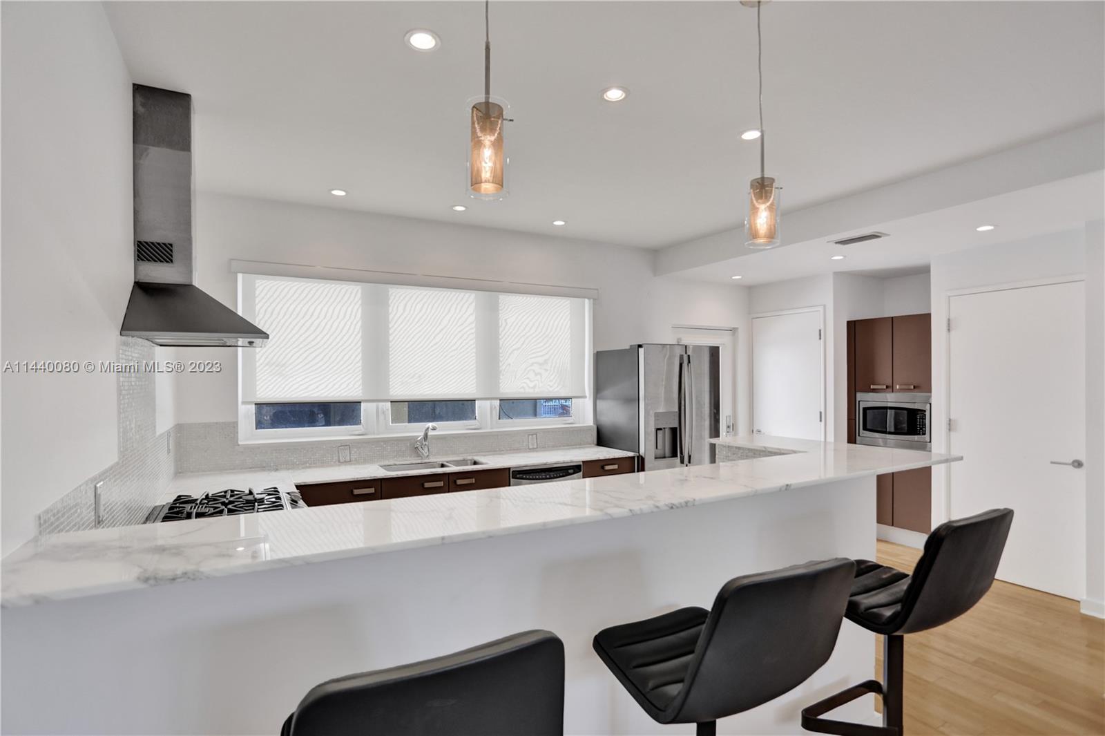 INCREDIBLE OPPORTUNITY to live in this stunning open concept unit, renovated to perfection. 

Allow this home to be your gateway to high class living in your WATERFRONT PARADISE. 
Enjoy kayaking from your backyard, biking along the beach boardwalk, and living among million dollar homes.

INTERIOR FEATURES: German Nolte kitchen with GE appliances, marble countertops, wood floors, high impact windows and 9 foot ceilings. Unit INTERIOR SIZE measures 916 Sq Ft.

EXTERIOR FEATURES: Heated pool, waterfront property surrounded by lush landscaping with private boat dock (dock available for just $200/monthly). Building is currently under the beautification process that will leave the property grounds pristine for many years to come.