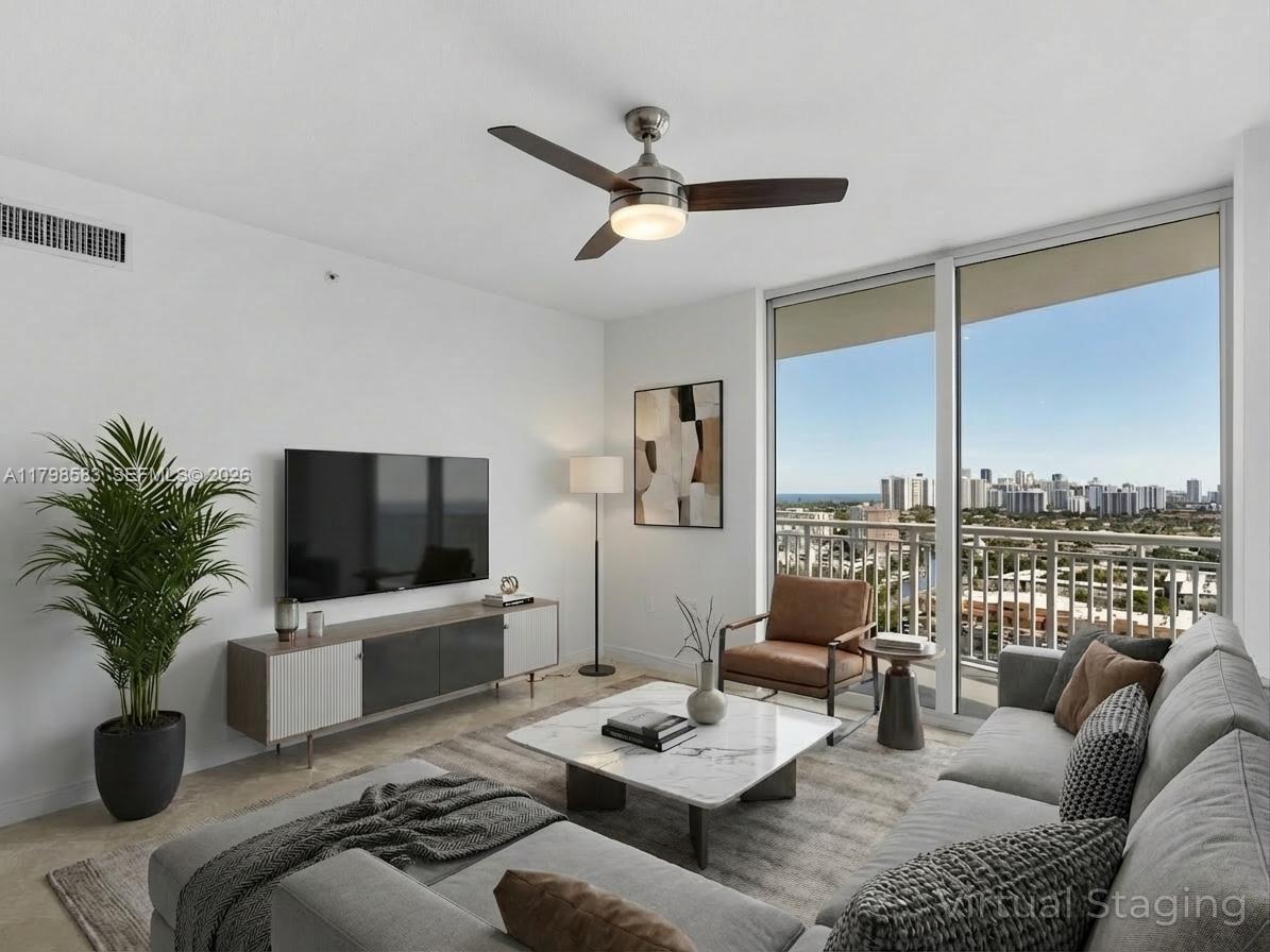 Welcome to the DOU Condominium at 1745 E Hallandale Beach Blvd, Apt. 2007W, Hallandale Beach, FL. This corner unit offers 1,354 sq. ft. of living space with 2 bedrooms and 2 bathrooms. The open layout is enhanced by central air and heating, ensuring comfort year-round. Enjoy expansive views from the wraparound balcony, perfect for relaxation. The modern kitchen seamlessly connects to the living and dining areas. Both bedrooms offer ample storage, with the primary suite featuring an ensuite bath. Residents benefit from amenities including a pool, spa/hot tub, sauna, and secure entry with high-impact doors. Additional features include a garage, assigned parking, elevator access, and a vibrant community atmosphere. This unit is ready for you.