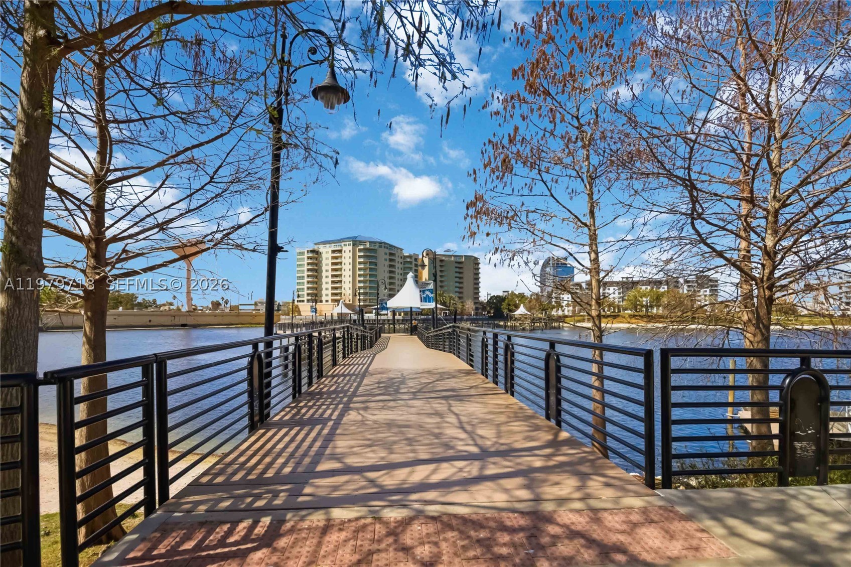 Beautifully renovated first-floor condo with a private balcony overlooking the lake and Cranes Roost Park. This unit features stylish upgrades including new flooring, an updated kitchen and bathroom with elegant quartz countertops, a screened enclosure, and a sliding glass door that enhances natural light and lake views. Cranes Roost Park is a stunning 45-acre park located in Uptown Altamonte, surrounding the lake with a one-mile lighted cobblestone walkway complete with benches and covered seating areas. The park also offers a pet-friendly walking path and hosts numerous outdoor events throughout the year, including spectacular fireworks and celebrations during Independence Day. The lake is well-stocked and fishing is permitted in designated areas. Dining, shopping, and entertainment—including the popular Altamonte Mall—are just steps away from the park and the condo. The Waterside community amenities include two swimming pools, tennis courts, a barbecue area, and convenient car wash facilities. Ideally located less than a mile from Interstate 4, the property is approximately 10–15 minutes from downtown Orlando and about 30–40 minutes to the beaches of Daytona Beach and Cocoa Beach. Golf enthusiasts will also appreciate the many renowned golf courses located throughout Central Florida just a short drive away. This condo is perfect as a primary residence, an investment property, or a seasonal winter retreat for snowbirds looking to enjoy the Florida lifestyle.