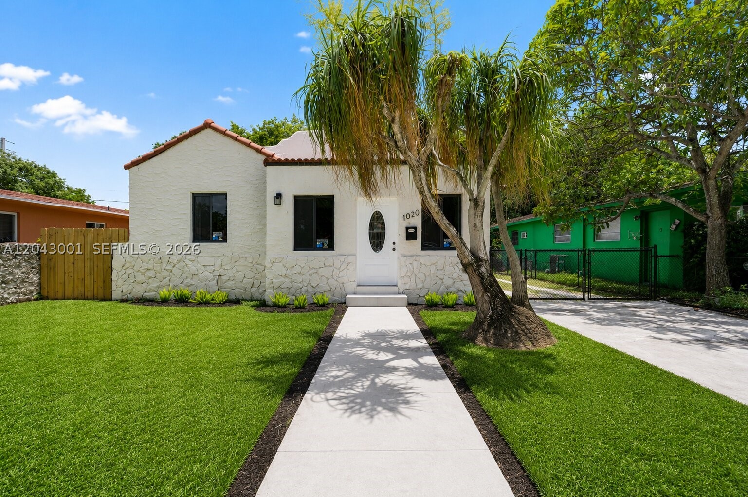 Fully gut-renovated 1925 Old Spanish home in Little River with a detached guest house offering private front AND rear alley access on a 5,000 SF lot. Main residence features 3 beds, 2 fully renovated baths, soaring ceilings, open-concept living flowing into a chef's kitchen with granite waterfall island, custom two-tone cabinetry, gold hardware & SS appliances. Wide-plank porcelain floors & black-frame windows throughout. Detached guest house is a blank canvas, ready to finish as private suite with bed, bath & kitchenette. 5,000 SF lot has room for pool addition. FEMA Flood Zone X, no flood insurance required. Minutes from Wynwood, Design District & Inter Miami's Nu Stadium development. Vacant & move-in ready. Some images virtually staged. Camera on premises.