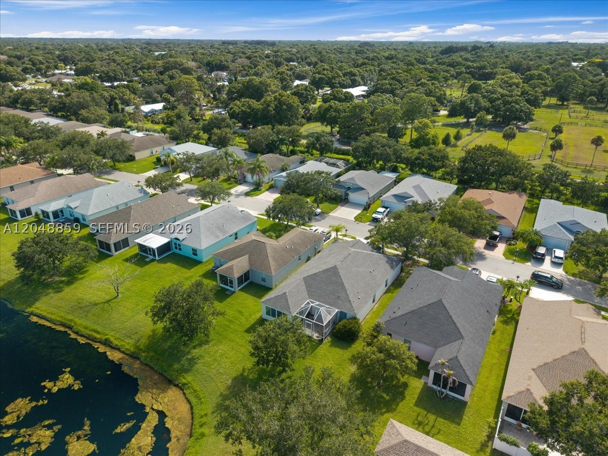 Calling all builders & investors. This inviting residence  features a bright, open floor plan with spacious living areas, a well-appointed kitchen, and generously sized bedrooms. The primary suite provides a peaceful retreat with ample closet space and an en-suite bath. Please note this house needs some work!!. Enjoy relaxing or entertaining on the private patio overlooking the beautifully maintained community, Waterford Lakes. Located just minutes from shopping, dining, medical facilities, parks, and Vero Beach’s renowned beaches, this home offers an exceptional opportunity for year-round living or a seasonal retreat. Don’t miss your chance to make this charming property your own and customize it to your needs! HOA rules state must own for 2 years prior to renting, no trucks, trailers or reactionary vechicles ( personal pickup truck is ok).