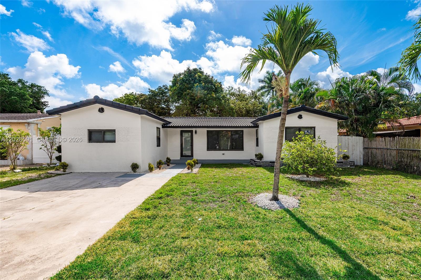 Beautifully and meticulously upgraded 3-bedroom, 2-bath single-family home located in desirable East Hollywood. This move-in ready property features a durable curved S-tile roof installed in 2009 and brand-new impact windows completed in 2026. The home has undergone a complete modern facelift, including a stunning new kitchen with granite countertops and stainless steel appliances, elegant 24x48 porcelain tile flooring throughout the living areas, fully upgraded bathrooms, fresh light-colored interior and exterior paint, updated electrical systems, central air conditioning, and enhanced landscaping for great curb appeal. Conveniently located near major highways, airports, and cruise ports, with easy access to fine dining, shopping, entertainment, Downtown Hollywood, and the beautiful Hollywood beaches. Perfect for homeowners or investors seeking style, comfort, and an unbeatable location.
