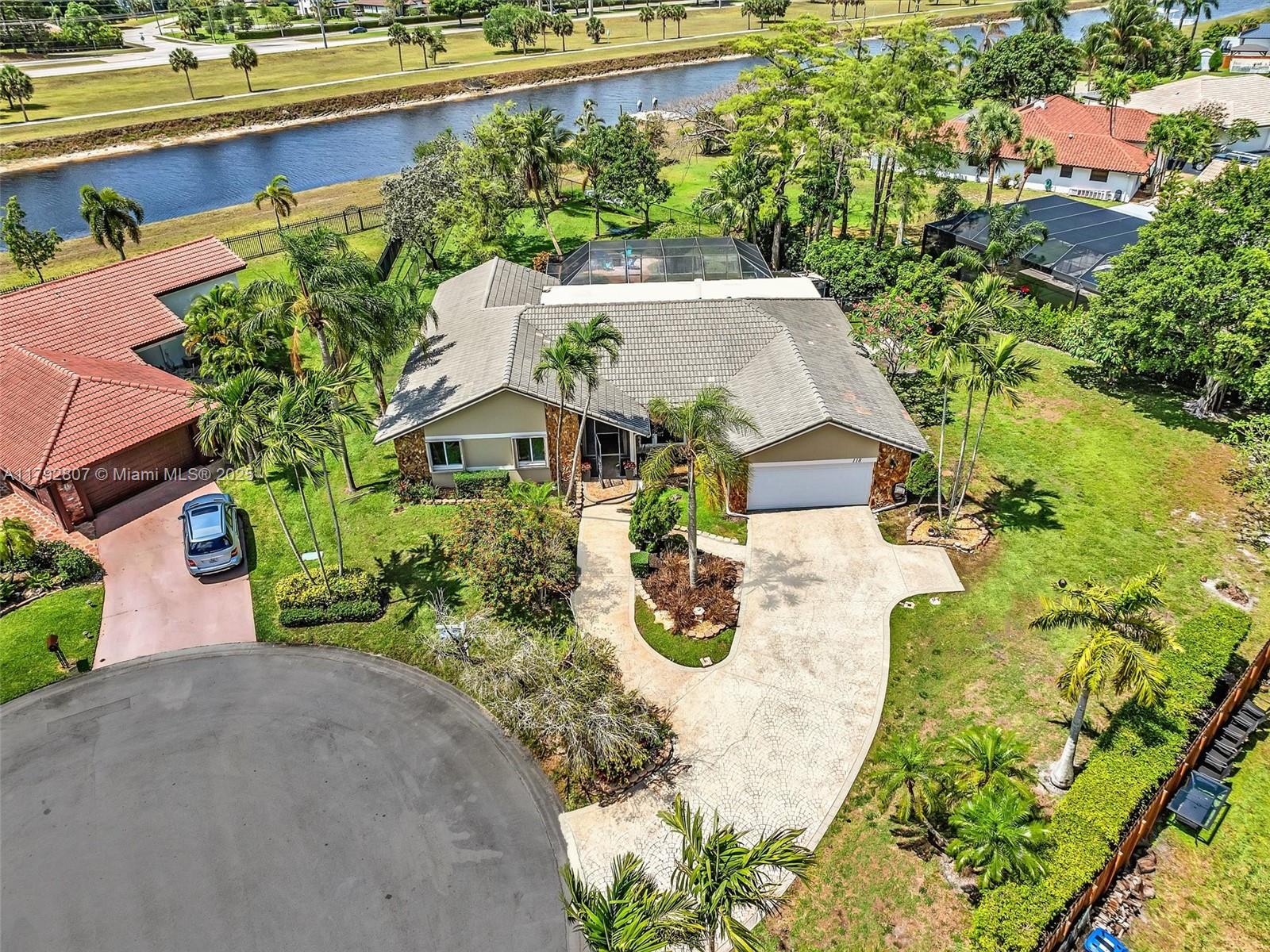 Welcome to your dream home in the highly desirable community of Oakwood! Waterfront, on nearly 1/2 acre lot and No HOA. Single-family home has 4BR, 2BA, and 2-car garage. Screened-in pool is perfect for cooling off on hot summer days. Rare nearly half-acre lot on a cul-de-sac offers both privacy and plenty of room for outdoor activities and entertaining, and is within walking distance to Oakwood Park! Enjoy hassle-free storm prep with impact windows/accordion shutters, while the vaulted ceilings and sunken shower facing an outdoor atrium create a tranquil and luxurious atmosphere. NO HOA gives you the freedom to personalize and enjoy your property to the fullest. Don't miss out on this unique find in the community of Oakwood - schedule a showing today and make this house your forever home!