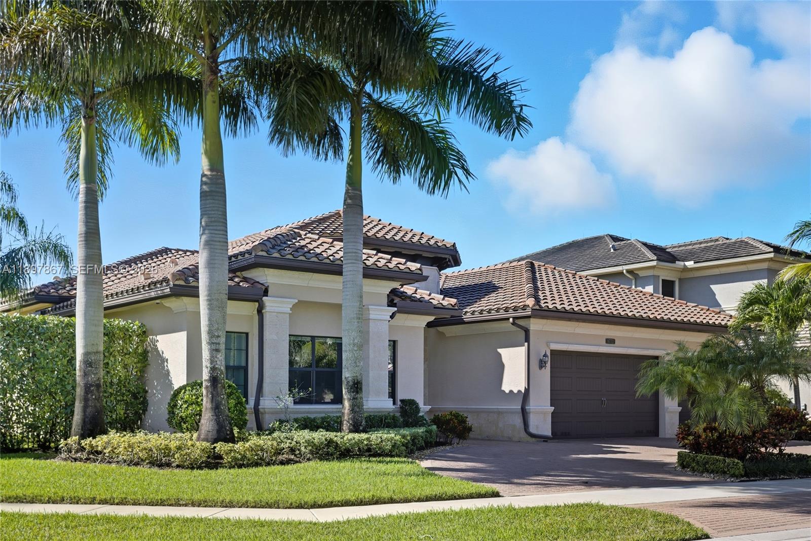 Motivated seller, price reduced by $50,000. 

Beautiful Charleston Grande model in Seven Bridges! This one-story 5BR/5BA home offers nearly 4,000 sq. ft. on one of the largest corner lots, providing complete privacy with no homes or roads directly facing the property. Just a short walk to the 30,000 sq. ft. clubhouse. Features include a gourmet kitchen with high-end stainless steel gas appliances, formal dining room, wet bar, impact glass windows, spacious ensuite bedrooms, and a circular driveway. The primary suite boasts a coffered ceiling, dual walk-in closets, and a luxurious bathroom with dual sinks. Enjoy the screened saltwater pool with heater and outdoor kitchen. Additional upgrades include a whole-house generator, camera system, and full-home water filtration. Meticulously maintained and move-in ready—this home is a must-see!