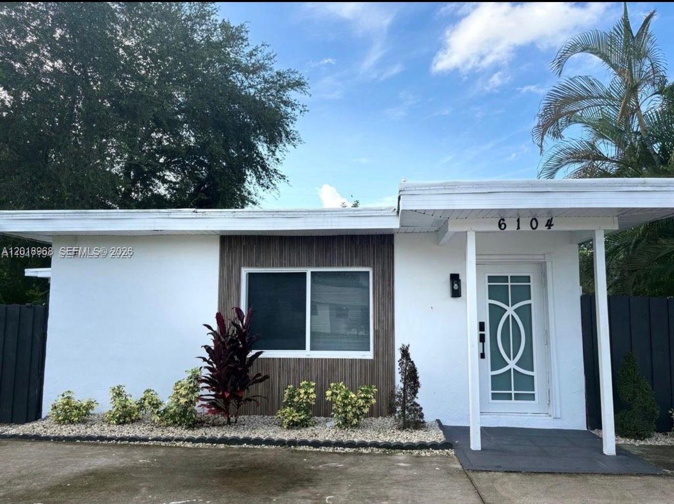 Beautifully updated property featuring a 2 bed / 2 bath main home plus a separate vacant 1 bed / 1 bath in-law quarters — ideal for extended family, guests, or rental income potential. Situated on a spacious 10,010 sf lot with 1,407 sf of living space, this move-in-ready home offers brand-new flooring, fresh interior and exterior paint, and a modern updated kitchen with quartz countertops and new stainless steel appliances. Both bathrooms have been stylishly renovated, and the home is equipped with hurricane impact windows and doors throughout for added peace of mind. Additional highlights include central A/C and heat, plus a brand-new washer and dryer. A rare opportunity with flexibility, upgrades, and excellent potential.