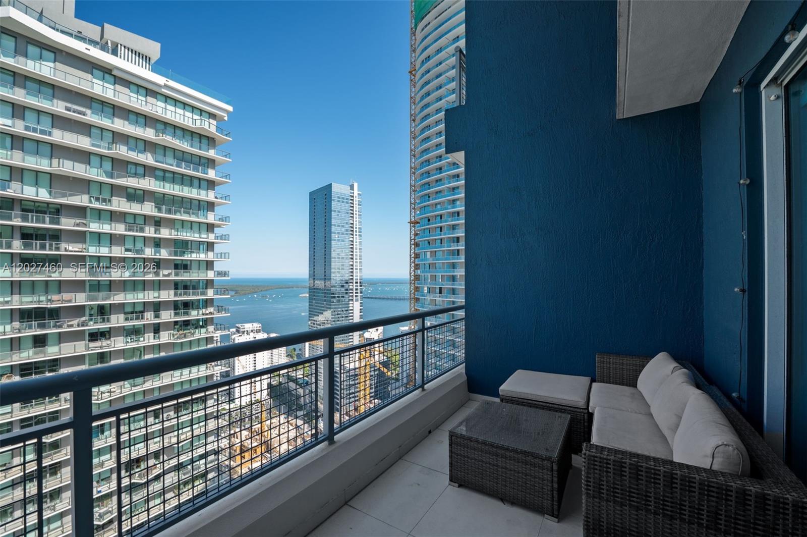 Experience the best of Brickell living in this stylish high-rise loft, ideally situated in the center of Miami’s vibrant financial district. This bright and contemporary 1-bedroom, 1.5-bath residence offers 686 square feet of thoughtfully designed living space and boasts one of the largest balconies in the building—perfect for relaxing, entertaining, and enjoy city and bay views. This unit has access to the spectacular rooftop terrace available for units from 40th floor and up. Residents enjoy an impressive selection of amenities, including a resort-style pool, fitness center, barbecue area, social lounge, concierge service, valet parking, and secured access throughout the property. The unit features stainless steel appliances, covered parking, washer & dryer inside, Italian style kitchen with granite countertops and modern backsplash,  and a pet-friendly environment that combines comfort, convenience, and urban sophistication.