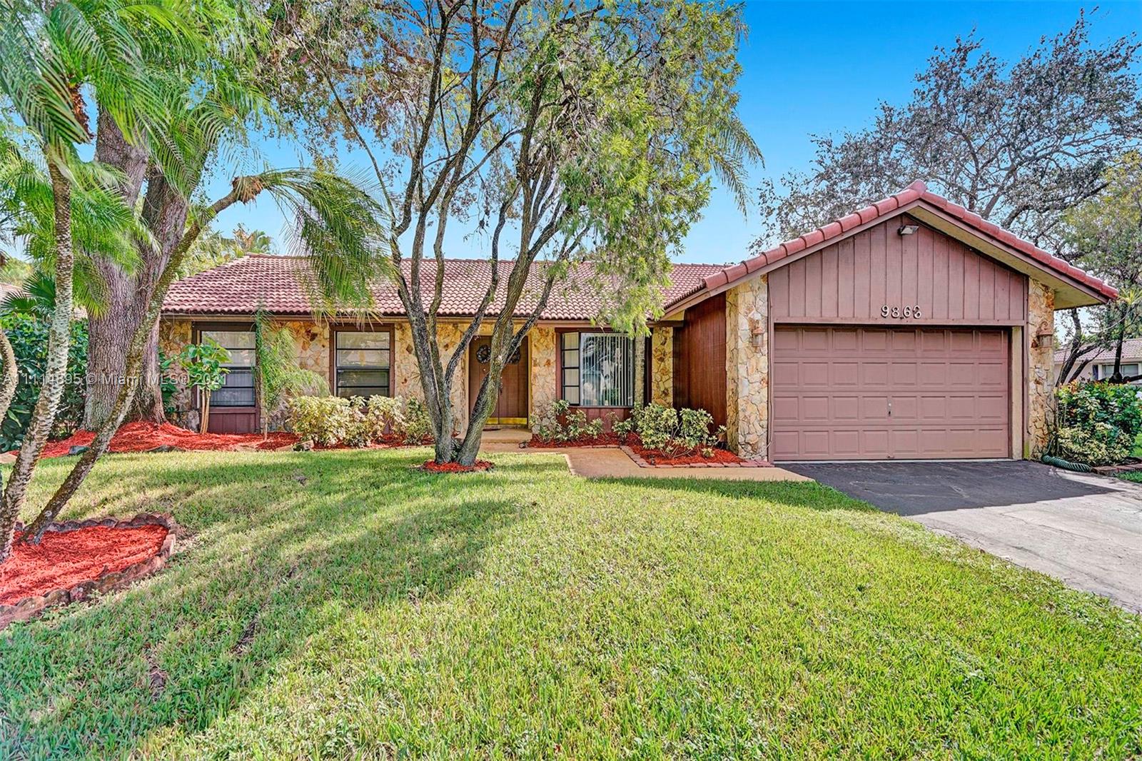 MUST SEE. Beautiful 4 Bedroom, 2 Bath Pool Home on a prime oversized corner lot in the sought-after Subdivision of Maplewood in Coral Springs with no HOA. This home is extremely light, bright, and airy and features volume ceilings, an eat-in kitchen with granite countertops, a sunken living room, a family room with bar and custom wood planking on the walls, a formal dining room or bonus room, making this home perfect for entertaining or family gatherings. The kitchen, family room, and Master bedroom all open via sliding glass doors to the large covered patio and screened-in pool area. Close to everything, including nightlife, restaurants, shopping, and walking distance to Dede Gilmore and Ralph Diaz Memorial Parks. Schedule your showing today before this home is gone!