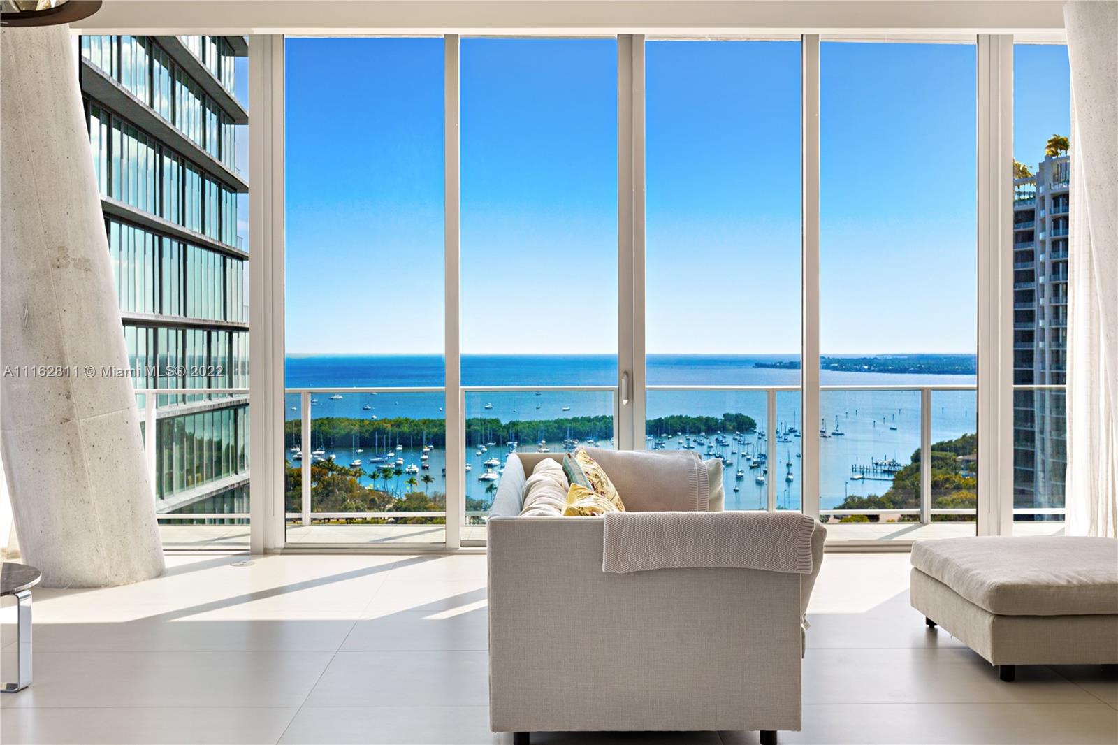Rem Koolhaas' vision of a twisting building was realized here situated in front of Miami's most beautiful bay front and parks with the best of restaurants, grocery stores and overall sense of community within walking distance. This prolific estate in the sky comes with a Miele kitchen, Ornare closet, custom wall paneling, marble tops, zoned HVAC, Lutron lighting, black out shades in all bedrooms with custom drapery. The home has a separate den and home office/maid's quarters and full laundry room. Comes with 2 adjacent parking spaces with private storage cage on the same level. Amenities include 24-hour concierge, butler, lap and roof-top pools, a modern spa, a state-of-the-art fitness center with spinning room, game room, pet spa, library, a private restaurant and valet parking services.