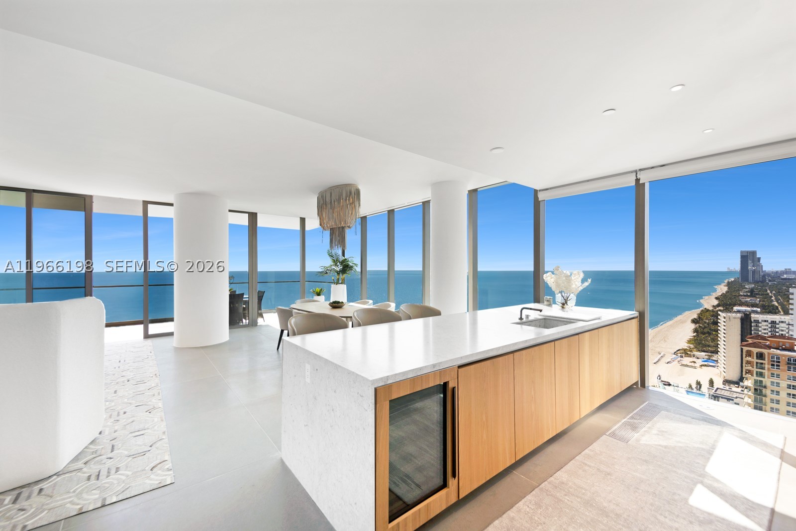 Dreaming of relaxing to the sound of ocean waves, exquisite barefoot walks on a pristine beach & a relaxed yet sophisticated resort lifestyle?  Welcome to 25B- A coveted half-floor SE corner sky home that captures cinematic 270° panoramas—Sunrise to Sunset and a glittering city skyline by night. Perched on the 25th floor above neighboring rooftops, this oceanfront residence commands unobstructed panoramic views that not only elevate daily living but enhance its value beyond lower-floor counterparts. Wrapped in dramatic walls of glass, the thoughtfully designed 3-bedroom flow-thru floor plan with a convertible den offers effortless flexibility for a 4th bedroom. Arrive in style with 24-hour valet & direct elevator entry. Enjoy a seamless indoor-outdoor lifestyle with expansive living areas and 2 massive terraces in a home curated for elevated entertaining and everyday serenity. 10-ft ceilings, Gaggenau & Subzero appl., automated blinds, full-sized laundry room, custom walk-in closets, & an inviting freestanding soaking tub with sunset views complete this refined coastal lifestyle. Enjoy resort-caliber amenities including 2 heated pools, daily beach service, tranquil yoga studio, serene spa, coffee lounge & Assouline library—Close to luxury shopping centers, dining, and renowned golf courses. Don’t miss this rare opportunity to own a boutique oceanfront sanctuary with incredible staff & truly extraordinary views.  Pet Friendly!  Seller Financing an option.