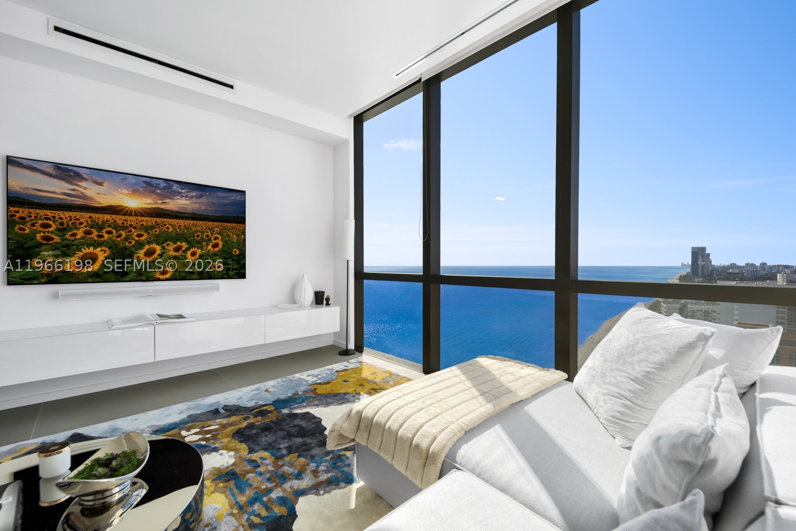 Dreaming of relaxing to the sound of ocean waves, exquisite barefoot walks on a pristine beach & a relaxed yet sophisticated resort lifestyle?  Welcome to 25B- A coveted half-floor SE corner sky home that captures cinematic 270° panoramas—Sunrise to Sunset and a glittering city skyline by night. Perched on the 25th floor above neighboring rooftops, this oceanfront residence commands unobstructed panoramic views that not only elevate daily living but enhance its value beyond lower-floor counterparts. Wrapped in dramatic walls of glass, the thoughtfully designed 3-bedroom flow-thru floor plan with a convertible den offers effortless flexibility for a 4th bedroom. Arrive in style with 24-hour valet & direct elevator entry. Enjoy a seamless indoor-outdoor lifestyle with expansive living areas and 2 massive terraces in a home curated for elevated entertaining and everyday serenity. 10-ft ceilings, Gaggenau & Subzero appl., automated blinds, full-sized laundry room, custom walk-in closets, & an inviting freestanding soaking tub with sunset views complete this refined coastal lifestyle. Enjoy resort-caliber amenities including 2 heated pools, daily beach service, tranquil yoga studio, serene spa, coffee lounge & Assouline library—Close to luxury shopping centers, dining, and renowned golf courses. Don’t miss this rare opportunity to own a boutique oceanfront sanctuary with incredible staff & truly extraordinary views.  Pet Friendly!  Seller Financing an option.