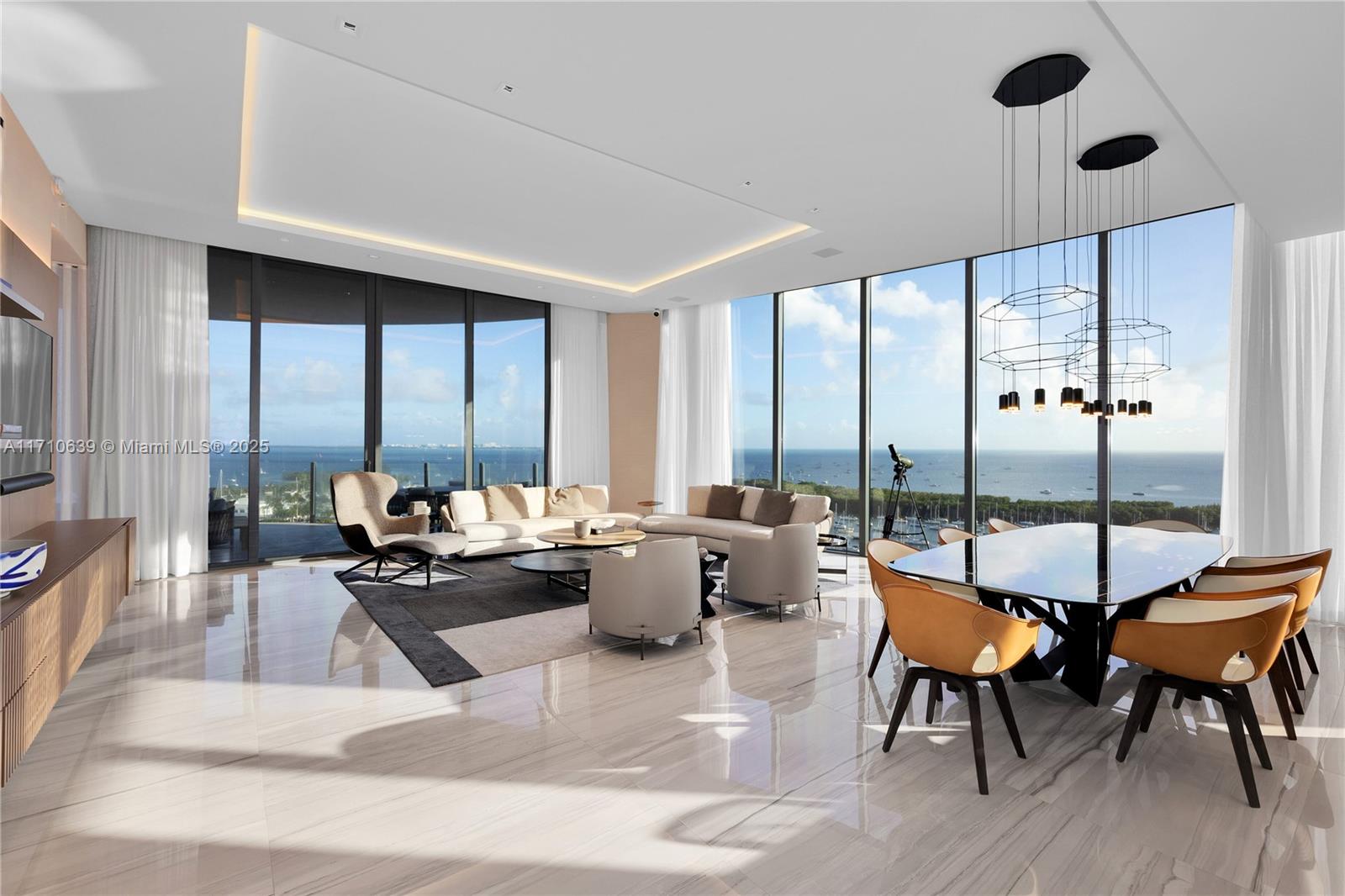 Come home to luxury in this 4-bedroom, 5.5-bathroom residence at the prestigious ONE Park Grove. With breathtaking views of the Coconut Grove Marina and beyond, this home in the sky is a masterpiece of modern design & unparalleled sophistication. Crafted by the renowned Miami designers of D/S, the interiors have been completely reimagined w/ built in cabinetry, paneled wood walls, designer lighting & furniture. The kitchen is by Italkraft with exquisite countertops, appliances by Sub-Zero, Wolf, and ASKO. Relax and entertain w/ a separate family/media room. Enjoy seamless living w/ fully automated lights, blinds, blackout curtains, dedicated laundry w/ bath, deep terrace & two parking spaces. Experience life at the pinnacle of luxury in Miami’s most sought-after addresses.