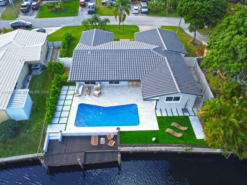 Fully Permitted Renovated Waterfront Home with Ocean Access

Stunning 4-bedroom, 3-bathroom waterfront residence completely remodeled with permits approved and closed.

Situated on a 7,377 sqft lot, this 2,200 sqft under-air home offers a seamless open layout, designer finishes, and modern coastal elegance throughout.

Recent upgrades include:
• Brand-new roof
• Impact windows and doors
• New electrical and plumbing systems
• 2021 A/C
• Fully renovated with permits closed

The chef’s kitchen features quartz countertops, custom cabinetry, oversized island, premium stainless steel appliances, built-in wine cooler, and sleek contemporary finishes.

Enjoy a private waterfront lifestyle with:
• Resort-style pool
• Expansive patio for entertaining
• Private dock
• Ocean access via fixed bridges

Two-car garage. Turnkey and move-in ready.