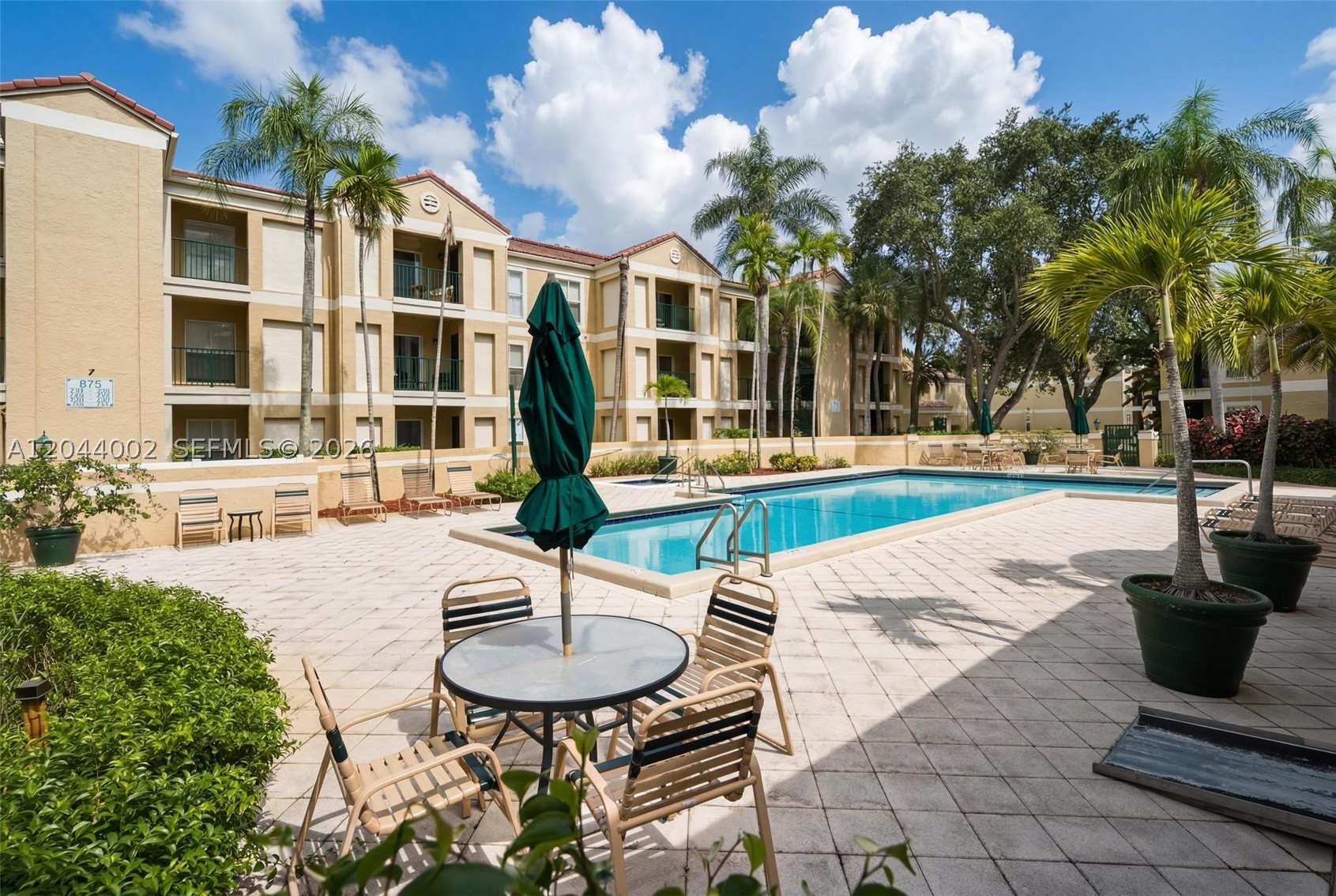 Move-in ready corner unit in the desirable Savannah at Riverside community! This spacious 950 SF, 1-bedroom, 1-bath second-floor condo features vaulted ceilings, abundant natural light, two private balconies, quartz countertops, renovated bathroom, large walk-in closet, generous interior storage, additional storage inside the unit, and in-unit washer & dryer. The open kitchen offers ample cabinetry and stainless steel appliances. Excellent opportunity for both owner-occupants and investors with immediate rental eligibility (per association rules). Pet-friendly community with pool, spa/hot tub, fitness center, BBQ/picnic area, and beautifully maintained grounds. One assigned parking space plus guest parking. Conveniently located near Coral Square Mall, Whole Foods, restaurants, parks, major highways, and excellent schools. Association has reserves, no current or planned special assessments, and Milestone Inspection and SIRS have been completed. Immediate occupancy available with a quick and easy approval process. Down Payment Assistance (DPA) programs may be available for qualified buyers. Contact listing agent for details. Tenant occupied through March 15, 2027. Tenants are willing to vacate with 60 days' notice, offering flexibility for owner-occupants or investors.