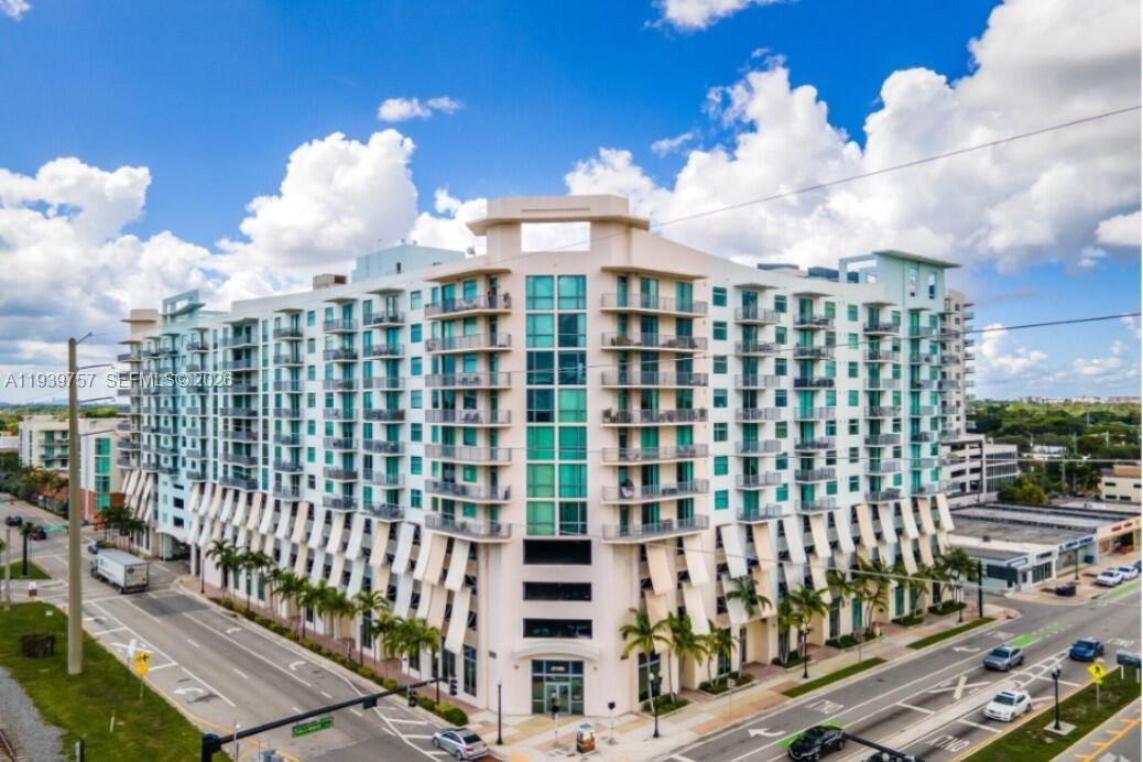Experience luxury living in this stunning 2-bedroom, 2 -baths corner unit with high-end finishes.  The open-concept kitchen boasts granite countertops and stainless steel appliances. Enjoy the expansive space with high ceilings and a spacious closet. The fully upgraded bathroom adds a touch of elegance, while the wrap-around balcony offers breathtaking views of the city and downtown Hollywood. This unit comes with an array of amenities, including a pool, jacuzzi, gym, sports lounge, 24/7 front desk service, valet parking, bike storage, and more. 2026 new A/C and Washer/Dryer inside the unit.  Water, trash, sewer, basic cable, and one assigned covered parking spot are included with this unit. Located within walking distance to downtown Hollywood, restaurants, and just minutes from the beach and Fort Lauderdale Airport - Pet allowed.  1/2 bath converted to a full bath. Unit currently rented for 2700 until March,2027