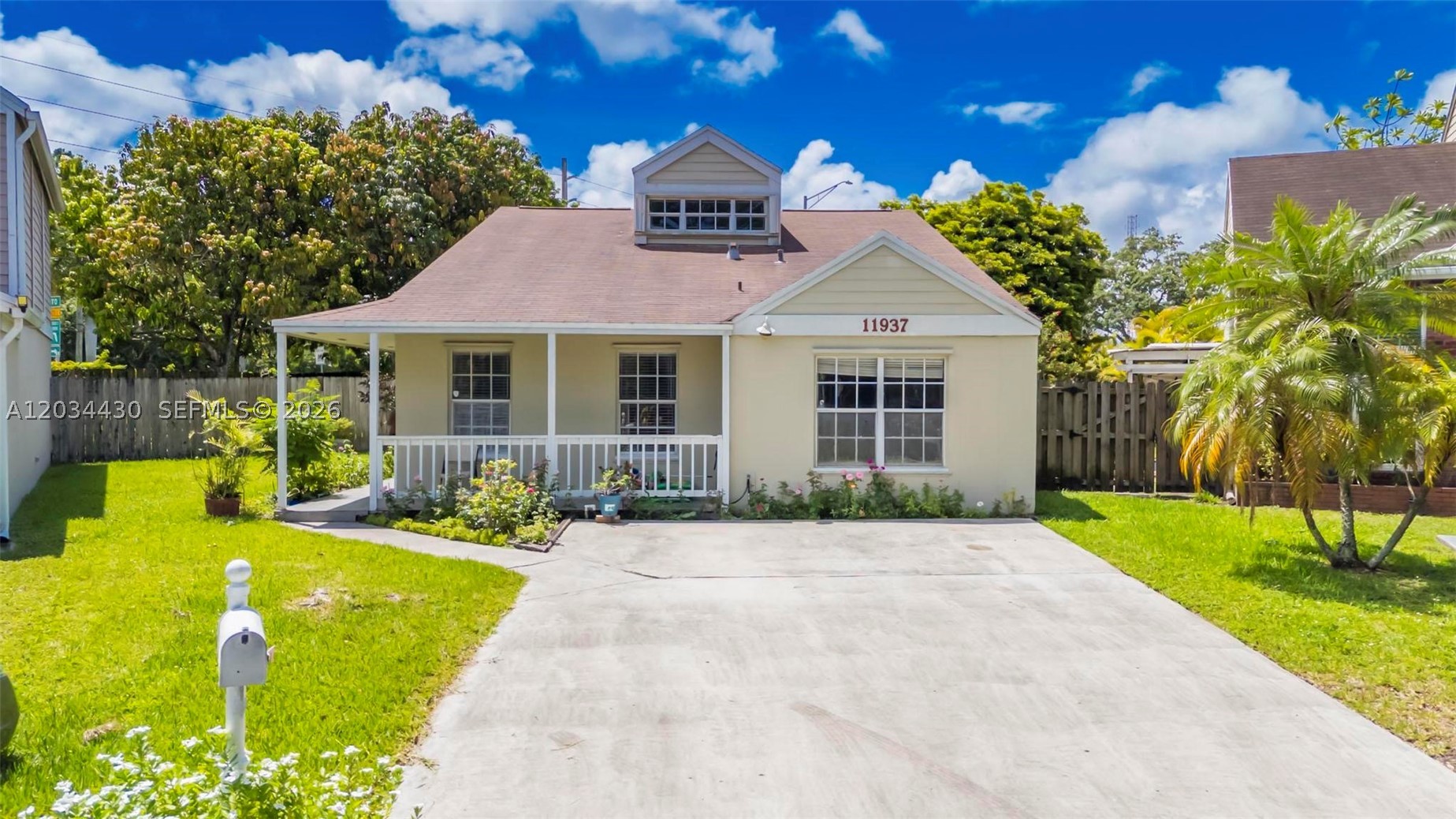 Welcome to the best value in Hampshire Homes, a charming cottage-style community in the heart of Kendall. Situated on the largest lot in the neighborhood, this pie-shaped property offers a rare combination of space, location, and potential. This single-story residence features 3 bedrooms, 2 bathrooms, plus office, and an oversized family room highlighted by vaulted ceilings creating an open and inviting atmosphere. The floor plan offers spacious living areas, generously sized bedrooms, and a comfortable primary suite complete with sliding glass doors that open directly to the covered patio. Outside, the expansive backyard provides endless possibilities for entertaining, gardening, play, or creating your own private outdoor retreat. The home's welcoming front porch and cottage-inspired façade add to its unique character and curb appeal. Conveniently located near top-rated schools, Publix, shopping and dining destinations, the Florida Turnpike, and SR-874, this location offers exceptional accessibility for daily commuting while maintaining the feel of a quiet residential neighborhood. While the home presents an opportunity for cosmetic updates and personal touches, it offers a fantastic canvas for buyers looking to add their own style and build instant equity. Priced to sell and offering exceptional value for the community, this is a rare opportunity to own one of Hampshire Homes' most desirable lots at an attractive price point.