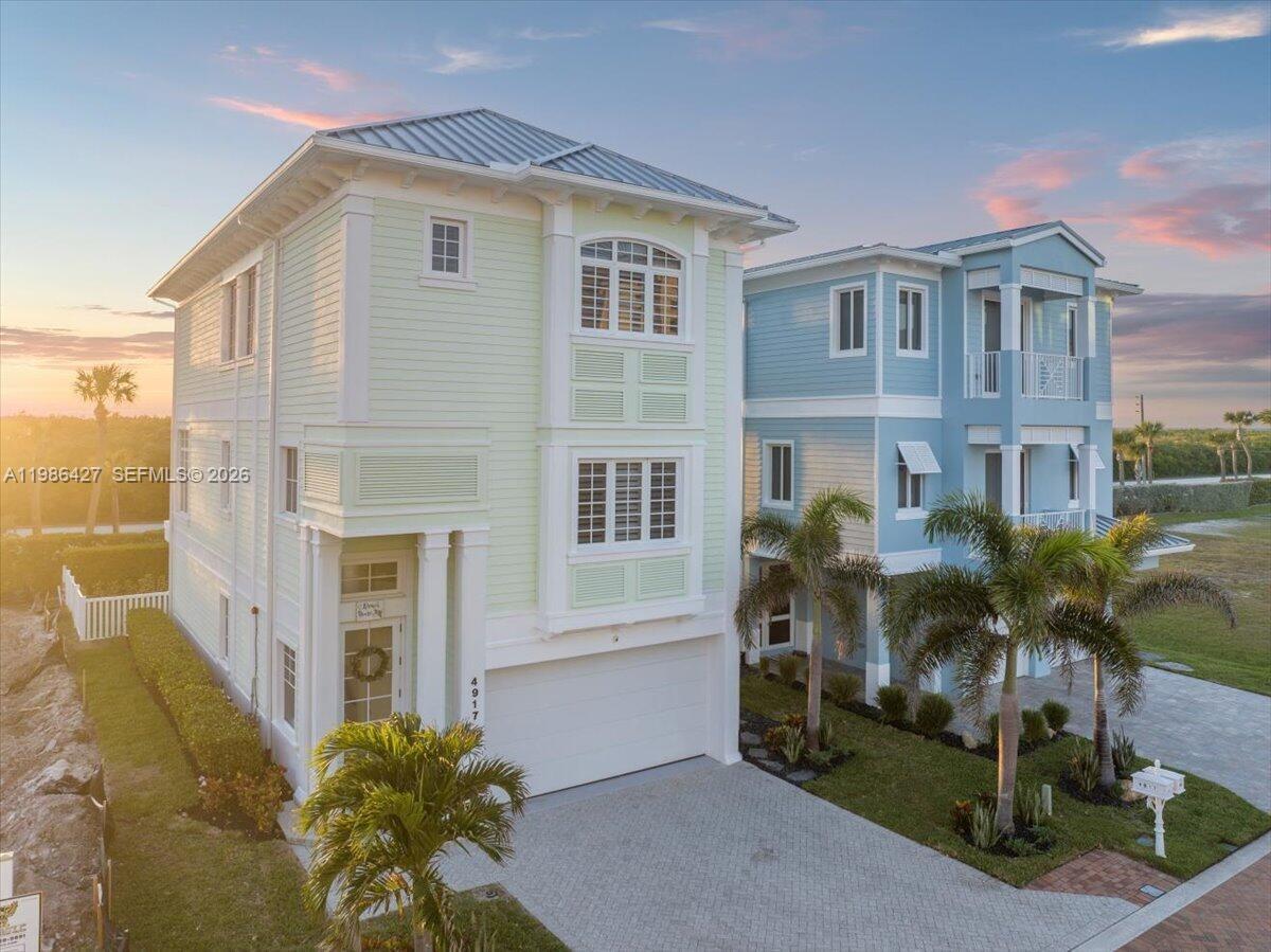 Ocean access. Intracoastal sunsets. Unmatched value. Located in the gated Watersong community on Hutchinson Island, this three-story residence delivers elevated coastal living with security and style. Solid concrete construction, impact windows and doors, and strong insurance advantages offer peace of mind without compromise. Inside, over 2,300 square feet unfolds into a bright, open layout with three bedrooms and three full baths. A split floor plan creates privacy, while a private elevator connects every level. Clean, modern updates enhance the home’s effortless coastal feel. Multiple rear balconies frame tranquil sunset views, creating a private outdoor retreat. Just steps away, enjoy exclusive beach access and a resort-style pool—hallmarks of the Watersong lifestyle. Minutes from downtown Jensen Beach, you’re close to waterfront dining, boutique shopping, boating, fishing, and private or commercial air travel. Priced $1.5M below the next available home in Watersong, this is the community’s best opportunity—same lifestyle, smarter investment. This isn’t just a home. It’s a strategic coastal acquisition.