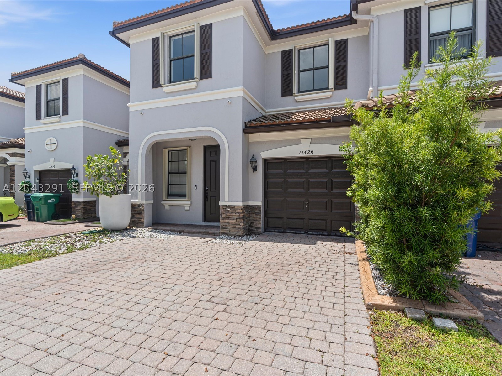 Beautifully renovated 4BR/3BA townhouse in sought-after St. Moritz at Islands at Doral. This 1,912 SF two-story home features a refreshed kitchen, new flooring, fresh paint, 1 bedroom/full bath on the first floor, spacious living/dining areas, 1-car garage plus driveway, accordion shutters and a private patio with peaceful lake views. Enjoy resort-style community amenities including clubhouse, pools, fitness center, tennis, basketball and BBQ/picnic areas. Move-in ready and delivered vacant at closing.