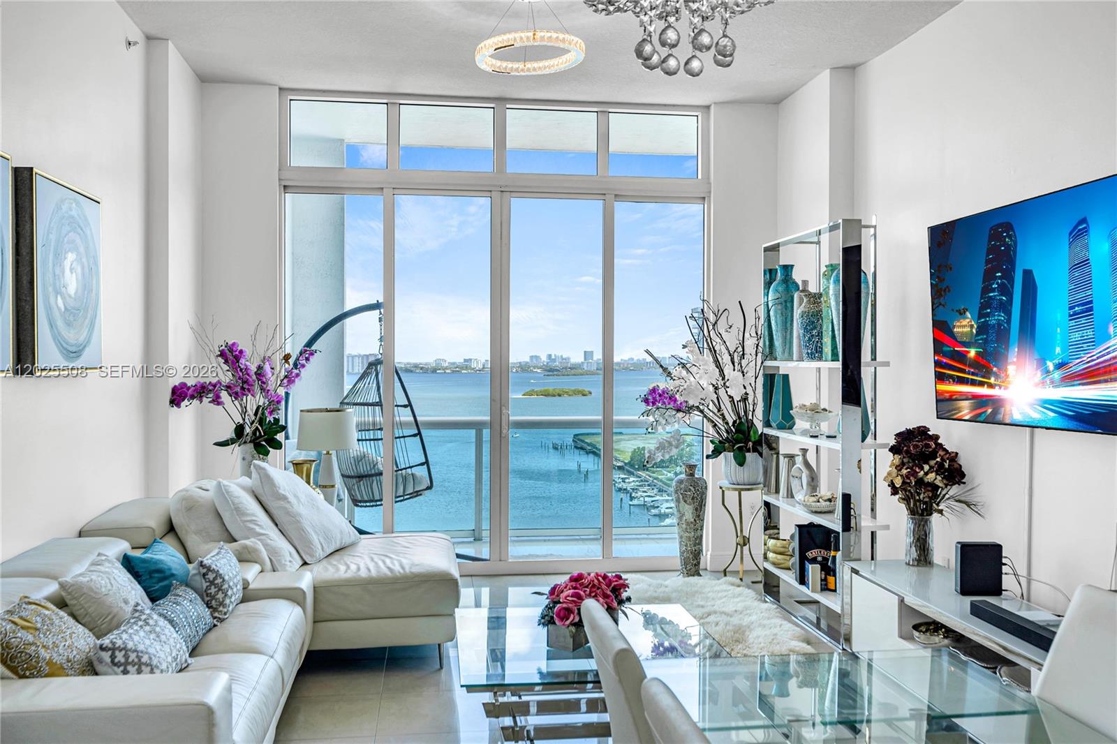 Welcome to Penthouse 14 at 360 Condo, one of North Bay Village's most sought-after full-service buildings sitting right on Biscayne Bay. This penthouse-level residence immediately impresses with 13'+ ceilings that open up the space in a way most Miami units can't offer. The split floor plan gives everyone their own corner of the home, and every bedroom wakes up to water views. The unit comes with in-unit washer and dryer, two parking spaces, a spacious balcony, and is leased fully furnished. The 360 Condo community is guard-gated and sits directly on the water with a private marina where residents can rent boat slips. Building amenities include two pools, a spa, state-of-the-art fitness center, men's and women's saunas, free valet for guests, and more! Miami Beach is 7 minutes away, Brickell and Downtown are about 25 minutes, Bal Harbour Shops are 15 minutes, and Miami International Airport is roughly 25 minutes.