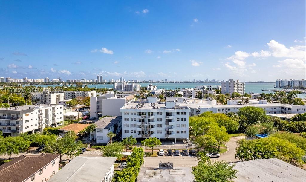 Charming Condominium in Normandy Isle. This beautifully updated condominium offers a modern living space, ideal for those seeking a peaceful retreat in a prime location. Recently renovated for a fresh and contemporary feel. Situated in the desirable Normandy Isle neighborhood, this home is conveniently located between the beach and North Bay Village. Take in lovely skyline views, framed by lush trees and low-rise buildings. The neighborhood boasts plenty of shopping, dining, and entertainment options within a short distance. The unit also includes a balcony, perfect for enjoying the serene view. This quiet building features a communal outdoor patio area, providing a cozy space for residents to relax. This is a great opportunity to own a move-in-ready home in a tranquil yet highly accessible location!