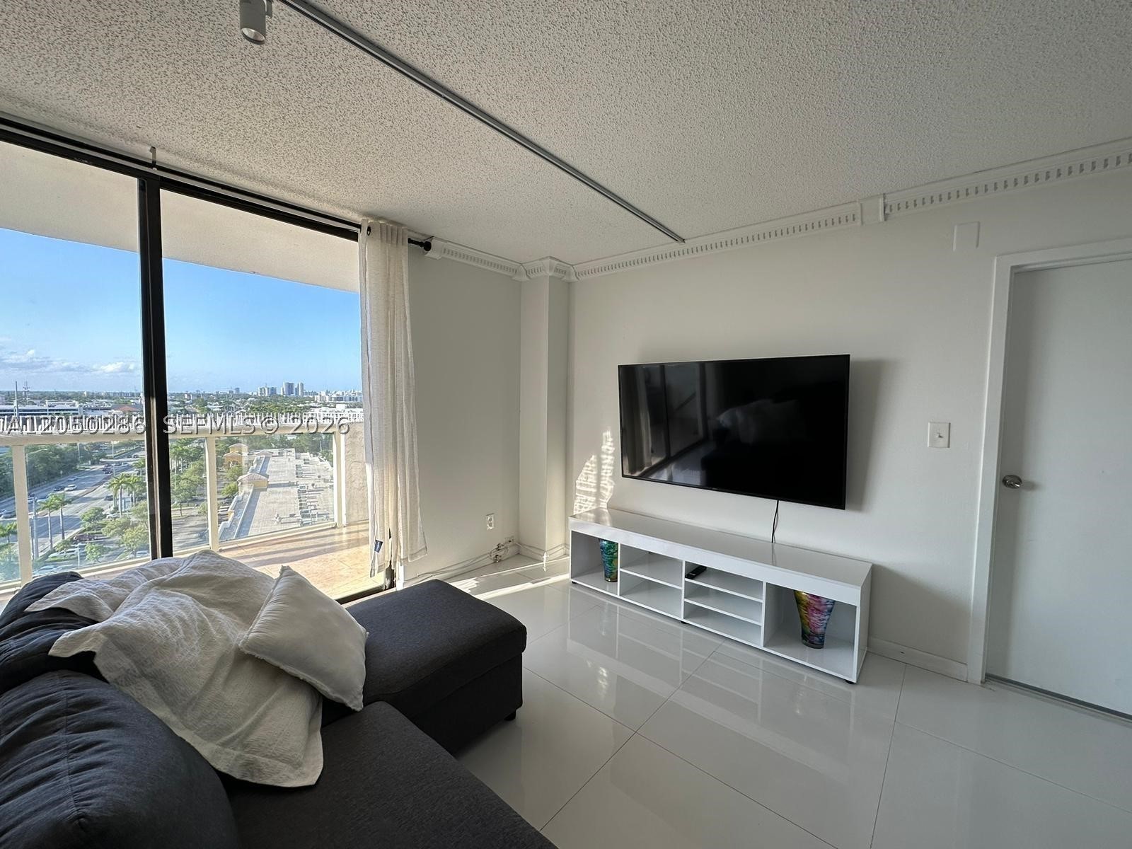 Bright and spacious 2-bedroom, 2-bathroom residence featuring a desirable split-bedroom layout, and an open-concept living and dining area filled with natural light. Enjoy beautiful canal views from the 14th floor in the well-maintained Sailboat Cay community. Ideally situated just minutes from Aventura Mall, Starbucks, a wide variety of restaurants, shopping, grocery stores, and Sunny Isles Beach, with easy access to FIU Biscayne Campus and major highways. Residents enjoy secure building access, guest parking, 24-hour laundry facilities, and a convenient lifestyle in one of the area’s most central locations.