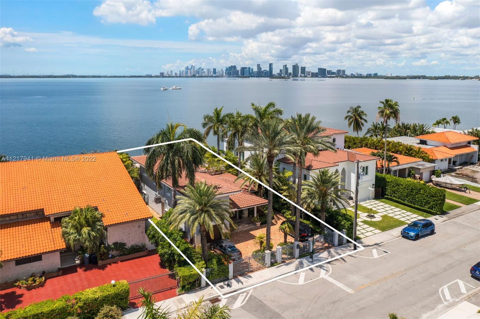 Enjoy spectacular unobstructed wide bay views of the Miami skyline & downtown Miami. Located in North Bay Village, this 2-story home sits on a 9,000 Sq. Ft. lot with 60 feet on the water. An entertainers dream with 4 bed & 4 baths and 1 half bath, marble & wood flooring, high impact windows. Kitchen complete with top-of-the-line Viking appliances, gas range, wine cooler, wall oven, kitchen island with eat-in sitting and formal dining table. The open floorplan blends the indoors & outdoors seamlessly to create an experience like no other. Exteriors feature Chicago brick paver driveway, private concrete dock, infinity edge pool, jacuzzi, wet bar, cabana bath, built-in BBQ, generator & rooftop deck to enjoy breathtaking sunrise to sunset.