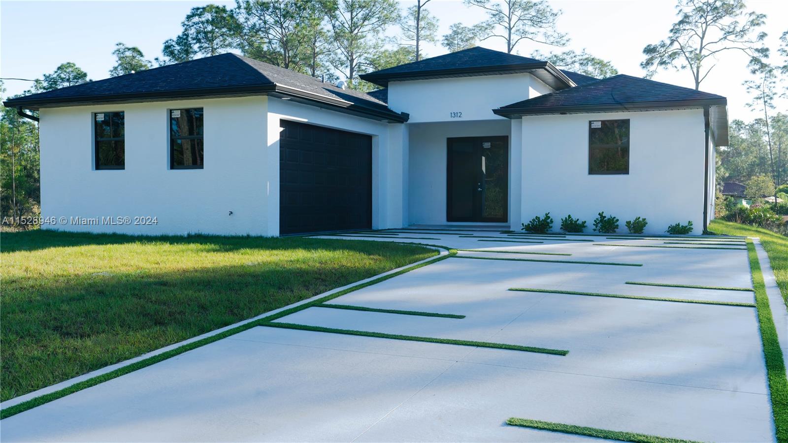 Discover elegance and modern comfort in Lehigh Acres with this stunning new construction, ready for move-in. Nestled on a spacious half-acre lot, this home offers 3 bedrooms, 2 baths, and a 2-car garage, designed with high ceilings and luxurious upgrades. Enjoy an oversized lanai, 40-gallon water heater, 3.5-ton central AC, high-impact windows and doors, tile floors, and a contemporary kitchen with quartz countertops. Equipped with 5 ceiling fans for added comfort, this home is one of many available locations for your perfect start. Don’t miss the chance to make this dream home yours.