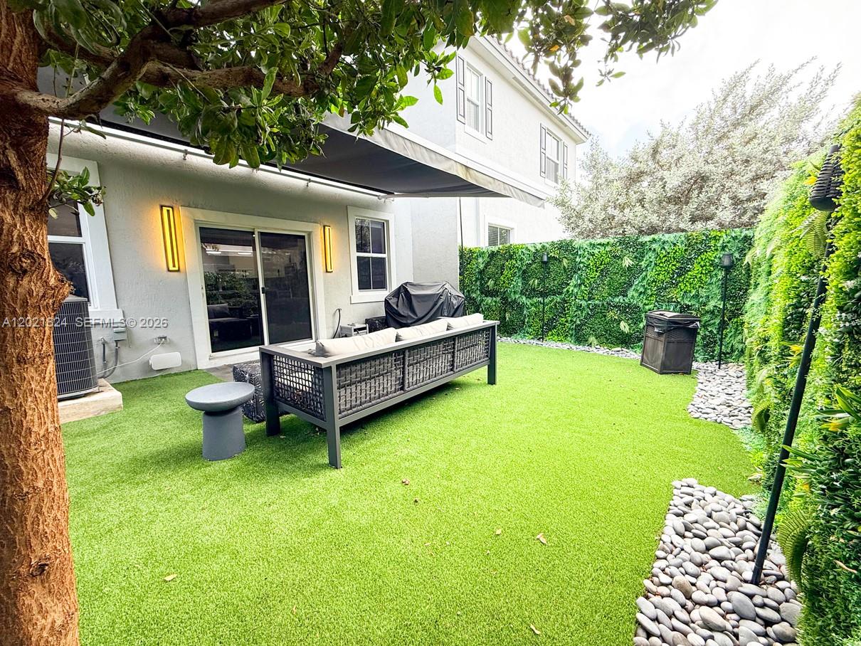 $10K Buyer credit* for this absolutely stunning turn key townhome with all the upgrades you can think of. Modern elegant finishes throughout, from the kitchen & countertops, SS appliances, to the Dark wood on both floors, accompanied by integrated smart home technology from the security cameras to the outdoor speakers. (Glass touch light switches & outlets throughout) Upgraded garage floors & lighting, including electric vehicle charging station, Geometric Wall Panels & Lighting, all while you relax or entertain outdoors in the cozy private turfed automatic retractable awning covered patio with outdoor "Sono" speakers.  

Minutes from Coral Springs parks, shopping, dining, and city amenities, Easy access to major roadways in all directions. A low-maintenance living option for a pet loving family looking for that upgraded modern comfort living.*Ask agent about buyer credit details