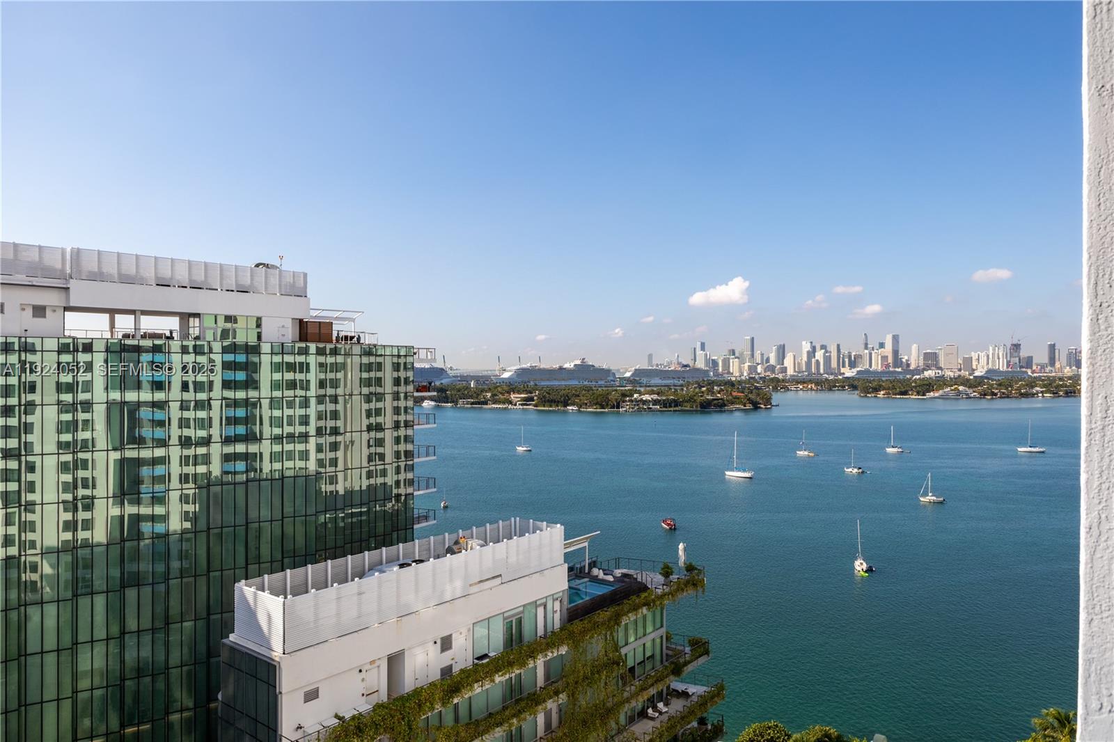 Experience refined coastal living in this elegant 1-bedroom at The Waverly South Beach, featuring sun-filled interiors, wood floors, and an open kitchen flowing into a spacious living area. Enjoy a large private balcony with stunning Bay and Miami skyline views plus serene garden scenery. The Waverly offers resort-style amenities including a bayfront pool, waterfront fitness center, 24-hour concierge, valet, security, tennis, volleyball, putting green, outdoor kitchens, koi garden, lounge, business center, EV charging, and more—just minutes from Lincoln Road, Sunset Harbour, top dining, markets, and the beach.