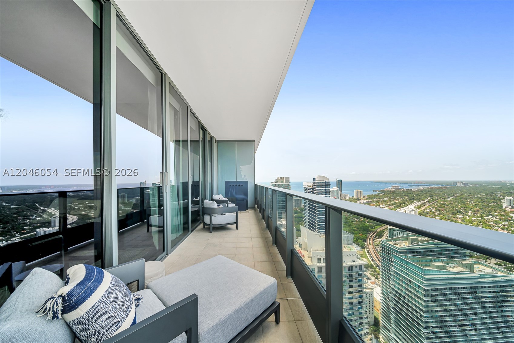 Fully furnished with Restoration Hardware furnishings and lighting, this corner residence at Brickell Flatiron offers 3 bedrooms, 3.5 baths, and unobstructed Miami views from every room. Floor-to-ceiling windows showcase panoramic water and city vistas throughout the home, filling the interiors with natural light from sunrise to sunset.

The open living and dining areas flow into a contemporary kitchen outfitted with Miele appliances. Thoughtfully customized by the owner, the residence is distinguished by striking designer wall coverings that add depth, texture, and character throughout. Additional features include automated shades, generous walk-in closets, and a split-bedroom floor plan that offers both privacy and flexibility for full-time living or a pied-à-terre.  Additional highlights include a private storage unit and three parking spaces (two assigned and one valeT). 

Located in the heart of Mary Brickell Village, residents enjoy access to Brickell Flatiron's exceptional amenities, including a rooftop pool, spa, fitness center, and 24-hour concierge. Fully furnished and move-in ready. Also available for lease (MLS A11988161).