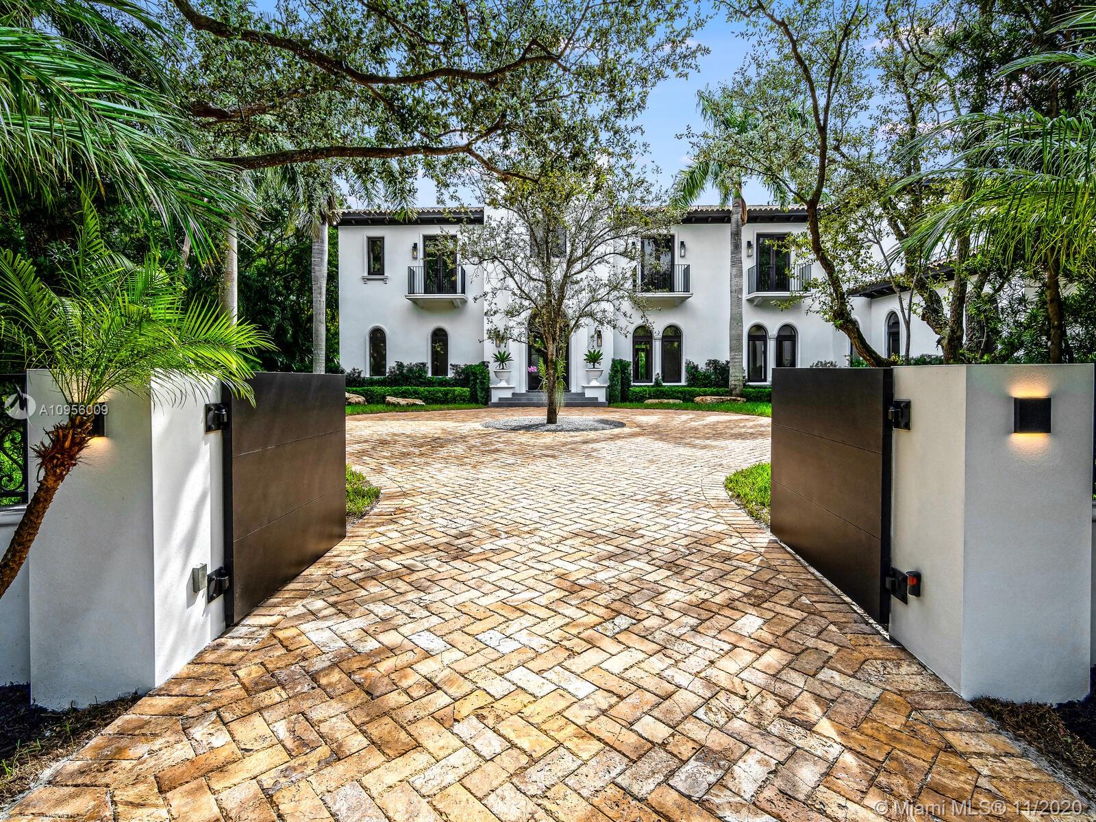 Recently renovated, this timeless estate is the epitome of Miami lifestyle. Enter through the dramatic foyer and fall in love with the curved staircase and rustic wood beamed ceiling. Modern & traditional details blend seamlessly to enhance the visual impact throughout. Architecturally-rich home has 9,848 total sq/ft with 7BD/7.5BA on a private builder’s acre with majestic oaks. The kitchen is an epicurean dream with Wolf/Sub Zero appliances & floor to ceiling stained oak cabinets. Open family room w/built-in custom bar. Grand 1st floor master suite with stunning bathroom. Smart home w/Control 4 automated system. Built 15.2' above sea level with impact resistant windows/doors to insure you'll be prepared for any climate! Home is ideal for entertaining....offering style, comfort & luxury.