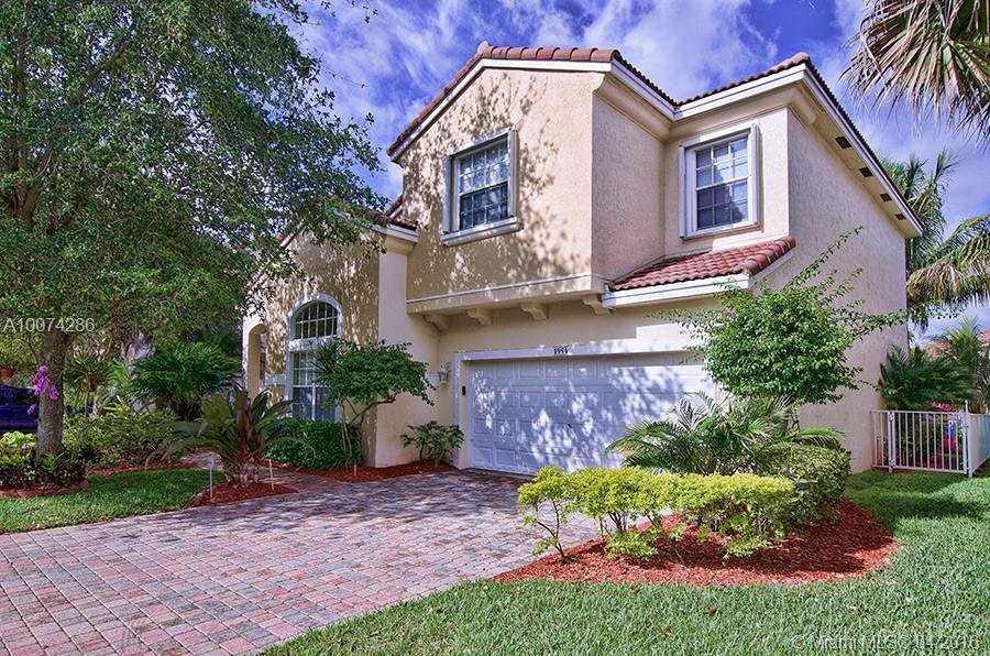 Light & bright lake-front beauty featuring all new granite & wood kitchen, pull-out pantry, SS appliances, high ceilings, neutral tones, crown molding, high-end window treatments, panel doors, luxury berber in bedrooms, tile downstairs, laundry room upstairs with newer HE Kenmore W & D, stunning lake views from master bedroom, retractable awning over extended patio, large fenced yard w/ lush tropical landscaping. Guard gated, community pool & impressive gym sure to impress all. Cable & Alarm included.