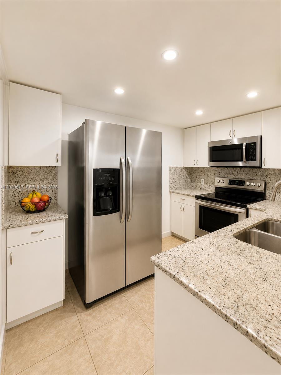 Lovely corner 1-bedroom, 1-bathroom condo ideally located just minutes from Sunny Isles Beach and Aventura Mall. Situated in one of North Miami’s most convenient and desirable areas, this well-maintained unit is approximately a 10-minute drive to the beach with easy access to I-95 and SR-826, making commuting simple and convenient. The interior has been freshly painted and features a spacious living area, large bedroom, walk-in closet, and ample closet and storage space throughout. The kitchen has been remodeled and the bathroom updated. Additional upgrades include a new A/C unit, high-impact windows, and new window blinds. The building is well maintained, and the low association fee includes water, insurance, garbage service, and monthly exterminator service.