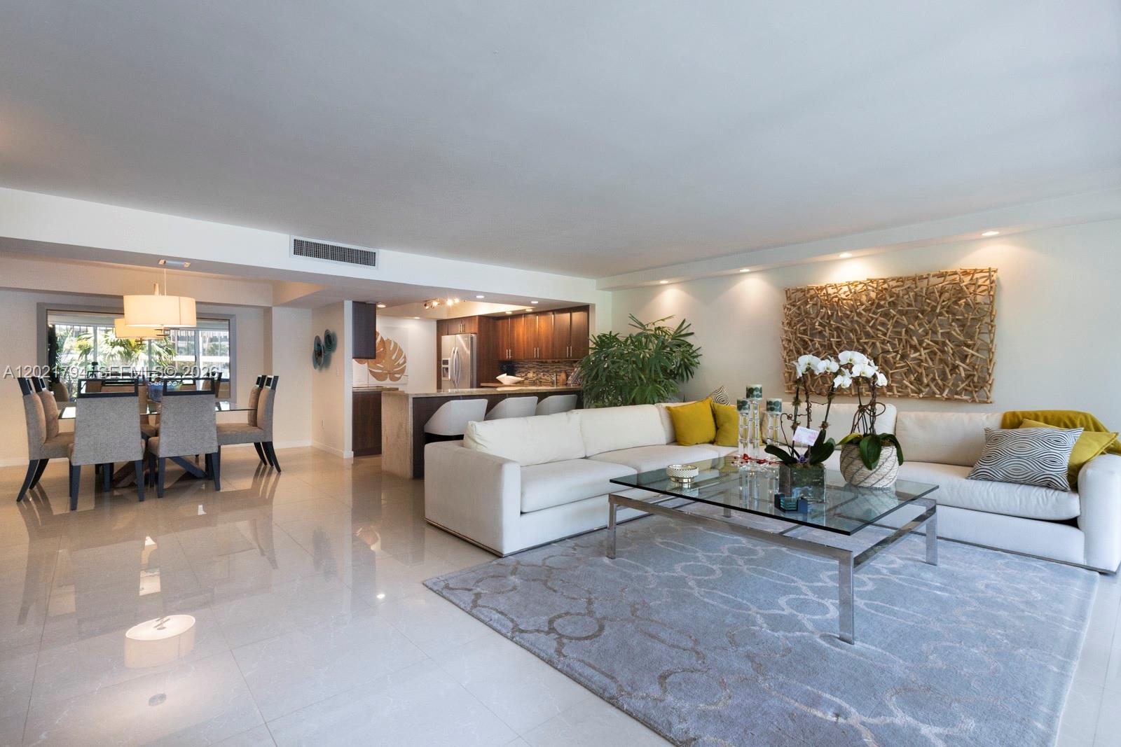 One of the most updated and least expensive units in sought after Grove Isle. Gorgeously updated and appointed large 2/2 layout with open living spaces, large primary suite and second bedroom, large terrace, laundry area and more.  Beautiful porcelain floors, stylish wood kitchen, and electronic shades.  Peaceful views and plenty of relaxing outdoor terrace space.  Enjoy the luxurious Grove Isle lifestyle which features fantastic amenities and a full service building.
