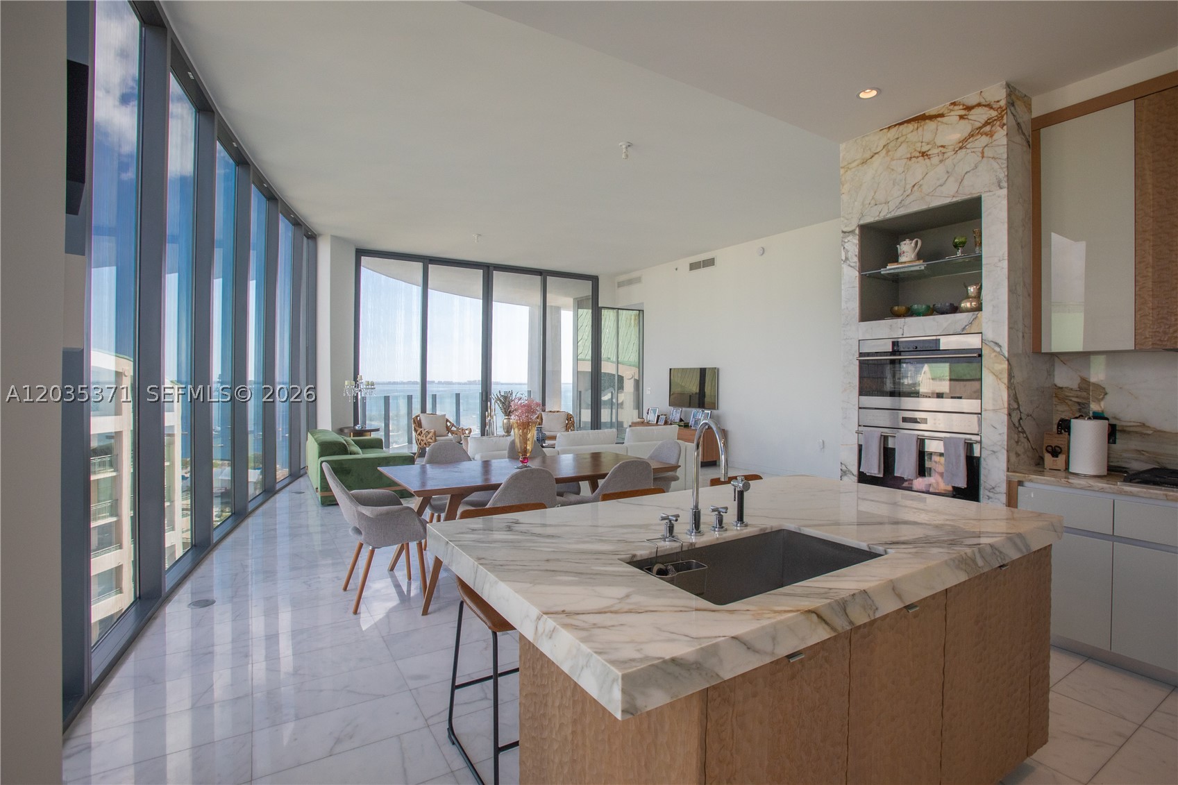 Top floor "D" line transformed by owner to a 4 bed / 3 bath. Kitchen re-designed to add extra cabinetry. Custom -build in unit. Den/office/storage room and extra storage at floor. Remote controlled vertical shades / blinds in every room. Two conveniently located parking spaces.