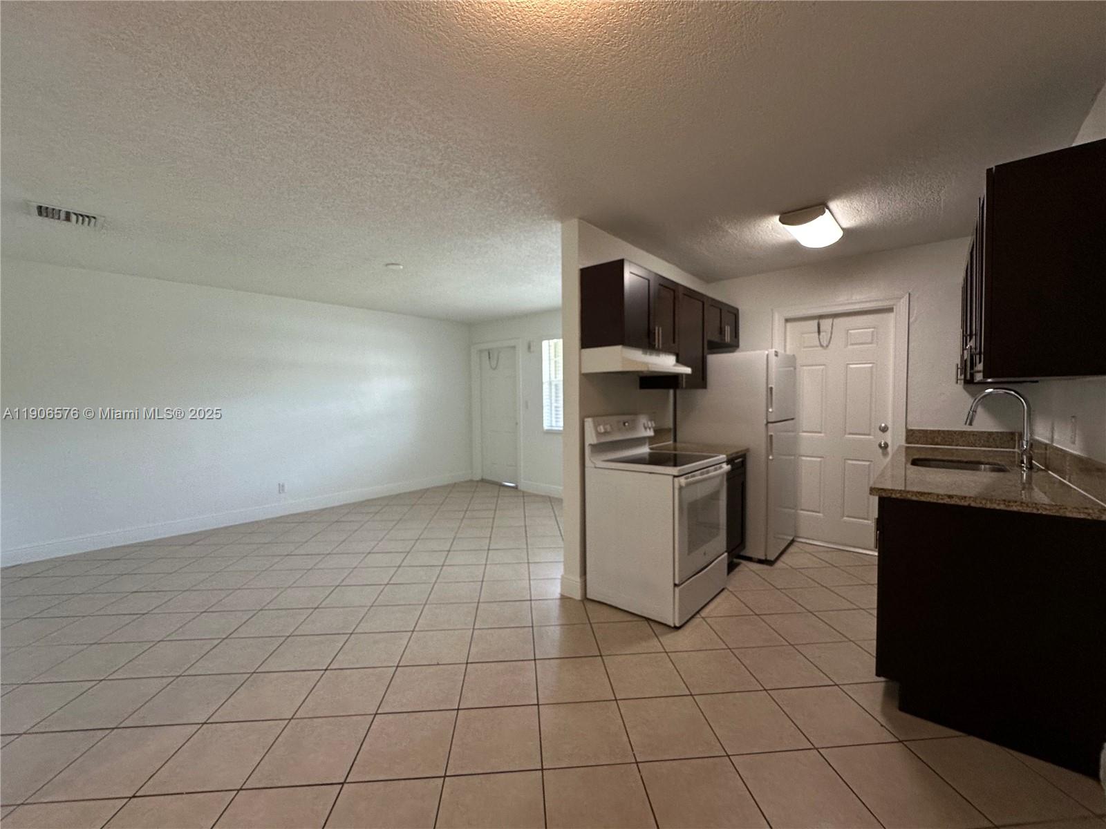SPACIOUS and newly upgraded 1 bed/1bath in Pompano Beach!!! Charming 2nd floor unit in a beautiful complex. Features newer tile floors, granite countertops, wooden cabinets, impact windows, central AC. Large living and dining room area with full kitchen and upgraded appliances. Located in a gorgeous, well-maintained community with plenty of amenities such as a sun deck, garden area, BBQ / picnic area, private pool, and full laundry room on-site. Gated community with security patrol. Water, waste, sewer, maintenance, pest control + 1 assigned tandem parking space included in rent. Pets welcome with 1x pet fee. Property is in a great area - centrally located, tucked away on a quiet street in a pretty neighborhood yet close to all of the major highways, shops, restaurants, schools, and parks.