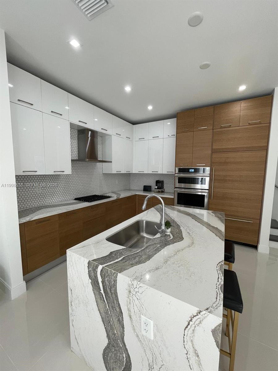 Canarias Ibiza Corner 2 story home with 3 Bedrooms, 3 Bathrooms, A Loft and 1 Half Bathroom. Featuring high ceilings, Jennair gas stove, microwave, wall oven and fridge. Italkraft kitchen cabinetry. Clubhouse with lounge room, business center, youth center, kids splash zone, pool, jacuzzi, gym, steam, basketball court, yoga room, and a covered under air conditioning running track. You can walk to restaurants, parks, school, Publix and much more.