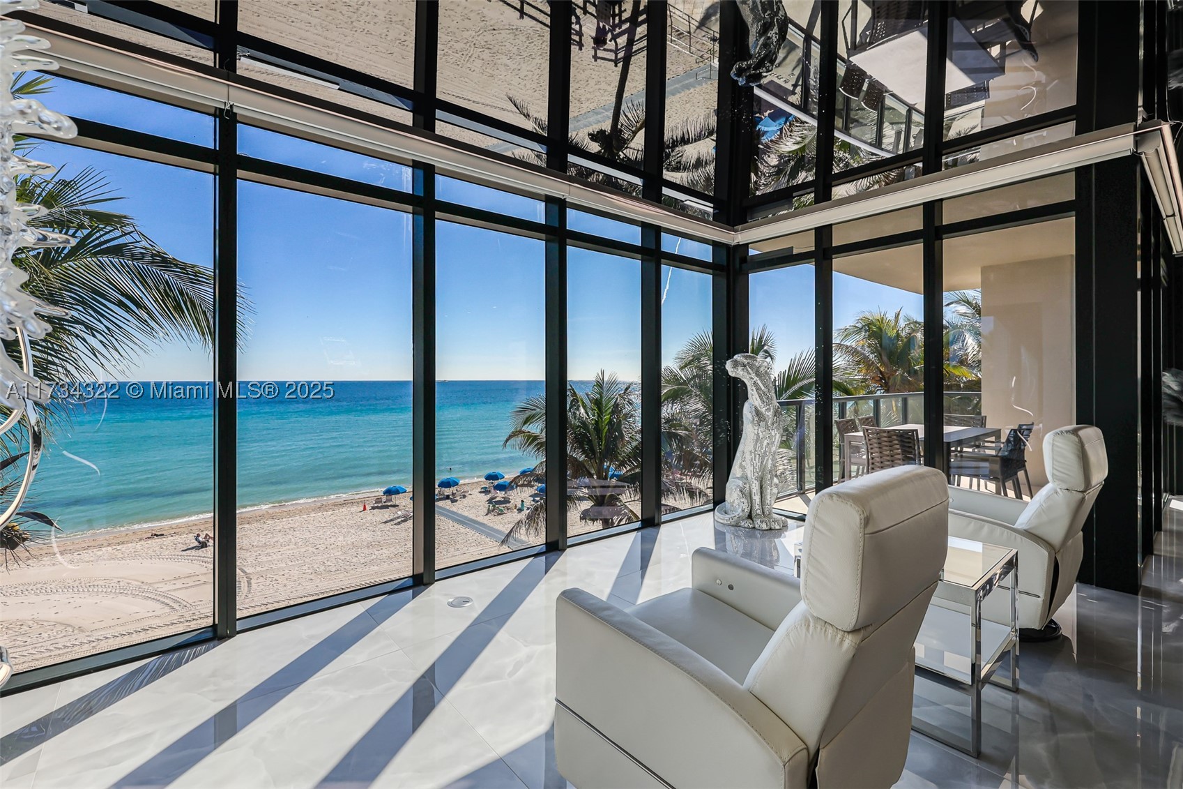 Discover beachfront luxury in this exclusive five-story boutique residence with direct beach access and panoramic ocean views. Designed by renowned Carlos Ott. With only two units per floor, a private elevator opens into your 2,606 sq. ft. retreat, featuring  three expansive balconies. This completely remodeled unit boasts premium flooring, custom ceilings, and elegant bathrooms. Fully furnished with exquisite taste, it offers three spacious bedrooms, each with an en-suite bathroom, plus a refined powder room. The gourmet kitchen features top-tier appliances, a wine fridge, and a gas cooktop with a built-in BBQ ideal for delightful dining. A large laundry room and same-floor storage add convenience. Located near top dining and entertainment, this residence offers refined coastal living.