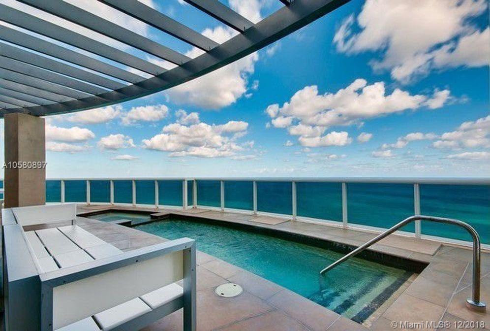THE MOST SPECTACULAR TURN-KEY 2-STORY PENTHOUSE ON THE BEACH. INCREDIBLE DIRECT OCEAN CORNER WRAP AROUND.  ONE OF A KIND RESIDENCE. AMAZING VIEWS ALL AROUND-DIRECT OCEAN VIEWS, INTRACOASTAL & SUNSET VIEWS. YOU HAVE IT ALL! MODERN FINISHES WITH BEAUTIFUL FURNITURE INCLUDED, OVER 21 FT CEILINGS WITH GLASS STAIRCASE AND PRVATE INTERNAL ELEVATOR ! 
APPROX 4,141 SF WITH FOUR BEDOOMS, 2 LIVING ROOMS, DEN, TWO KITCHENS, PLUS A 2,000 SF HUGE WRAPAROUND UPPER LEVEL PATIO  THAT HAS A  PRIVATE SWIMMNG POOL. RESIDENCE IS FULLY LOADED WITH SOUND, AUDIO, ELECTRIC SHADES & CLIMATE CONTROLS. INCLUDES ALL FURNITURE (EXCEPT ARTWORK).  PRIVATE BEACHFRONT CABANA INCLUDED!!!!!.