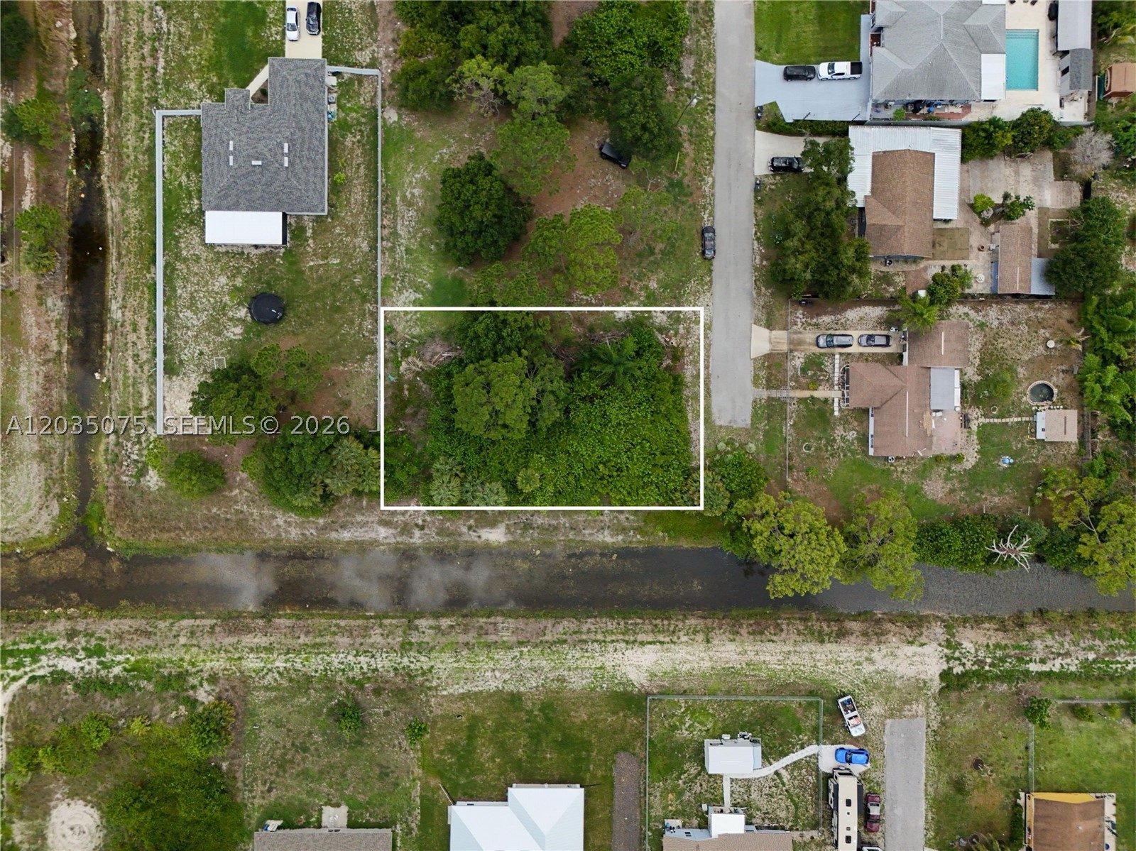 Fantastic opportunity to own a 0.32-acre residential vacant lot located in Lehigh Acres, FL, PID 10-45-26-L2-02026-0030. Situated in a growing area of Lehigh Acres, this oversized homesite provides ample space to build your custom dream home while enjoying the privacy and flexibility that Southwest Florida living offers. Conveniently located near schools, shopping, dining, parks, golf courses, and major roadways, this property combines a peaceful residential setting with easy access to everyday amenities. A private well typically provides water service in this area, and a septic system generally handles wastewater disposal. Electric service is available nearby, making this property ready for future development. Buyers should verify all utility availability, permitting requirements, and development standards with Lee County and the appropriate utility providers.
