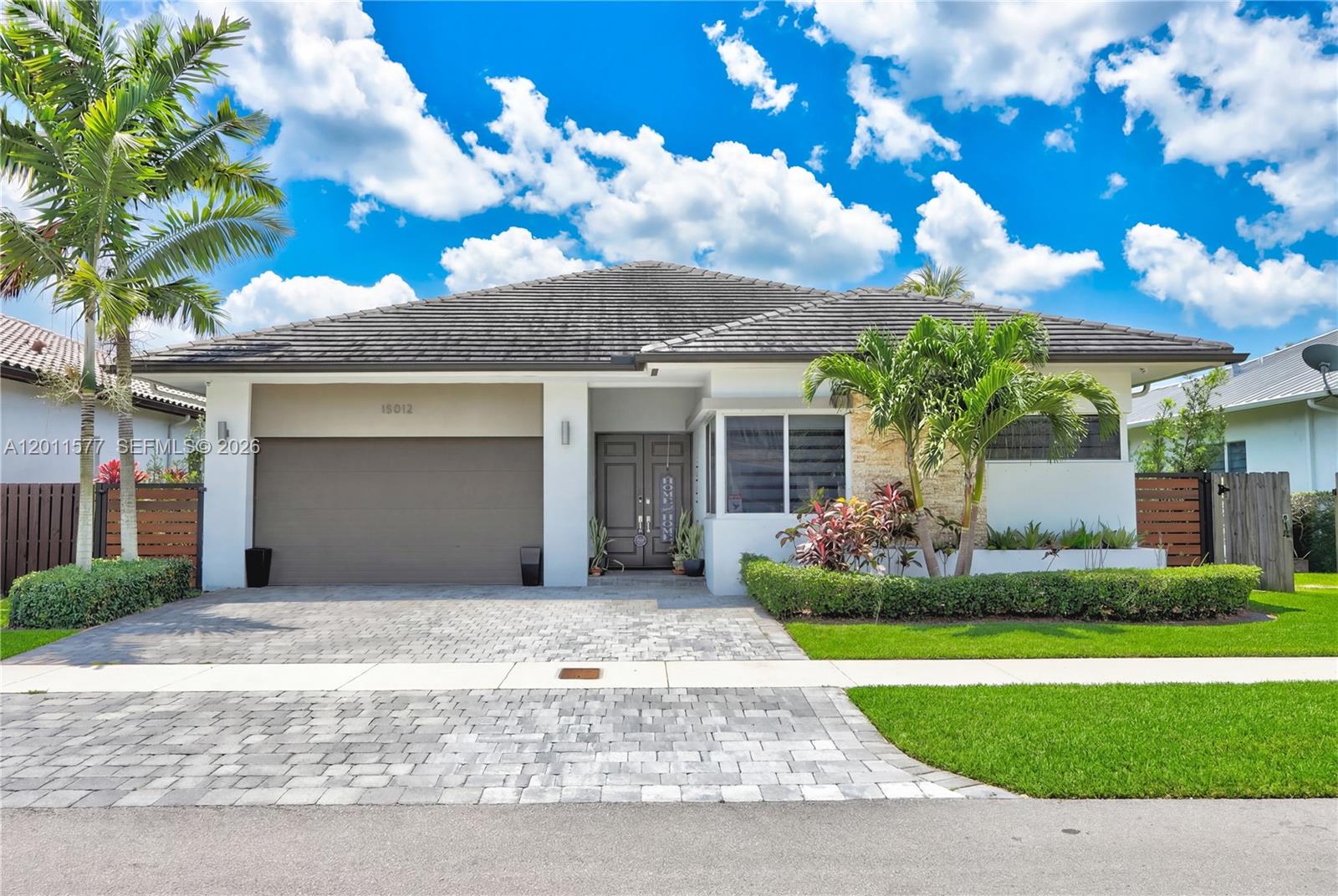 Experience modern elegance in this stunning Island Colonial residence located in the prestigious community of Venetian Parc. This immaculate one-story home stands out with its soaring volume ceilings and a bright, open-concept layout designed for seamless entertaining and abundant natural light. The gourmet-style kitchen flows perfectly into the spacious living areas and a private patio that creates the perfect outdoor retreat. Complete with a dedicated laundry room, a 2-car garage, and premium finishes throughout. Beyond the home, enjoy a resort-style lifestyle with access to the exclusive Venetian Parc Club, featuring a sparkling pool, fitness center, and clubhouse. Perfectly situated with a remarkably low HOA, this move-in ready home is a true gem.