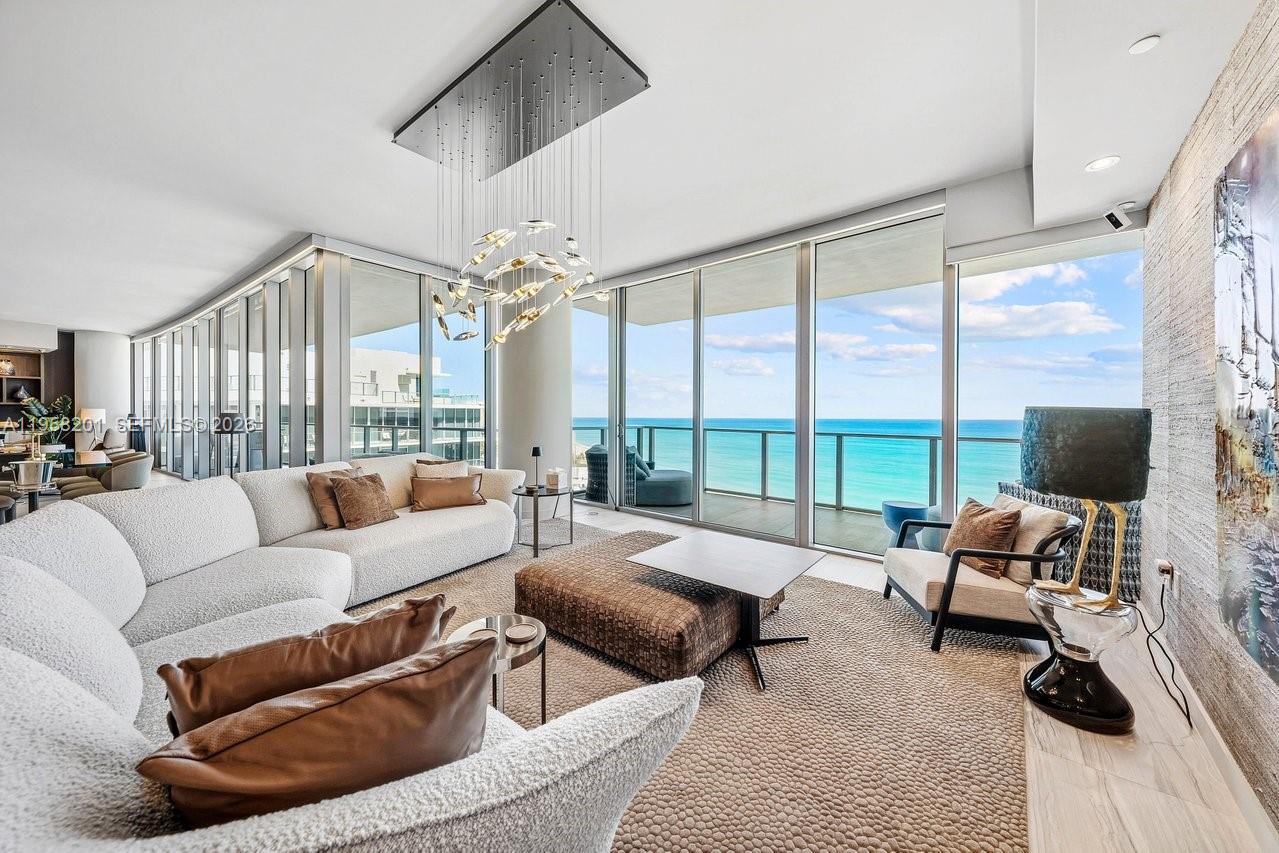 One-of-a-kind flow-through residence spanning 4,498 SF plus nearly 1,000 SF of terraces at Auberge Beach Residences. This impeccably customized 4-bedroom, 4-bath + 2 powder room home offers sweeping ocean and sunset views and generous indoor-outdoor living. Designed as a coastal retreat, the residence combines generous scale, natural light, and elegant finishes with a clean refined interior.

Features include artisanal Italian walnut millwork, custom imported Italian cabinetry and doors, Phillip Jeffries wallcoverings, and book-matched marble feature walls. Chef’s kitchen with Italkraft cabinetry, bespoke Italian white-veined stone countertops, Wolf, Sub-Zero, and Thermador appliances, plus custom bar with Monogram refrigeration.

Primary suite with spa-inspired bath, dual shower, and luxurious walk-in closet. All bedrooms have their own en-suite. Additional features include Control4 automation, upgraded HVAC with UV filtration, four parking spaces, two double-height private storage units including wine and humidor storage. Full access to Auberge’s five-star amenities including Evara Beach Spa, Del Mar restaurant, fitness center, and resort-style pools.