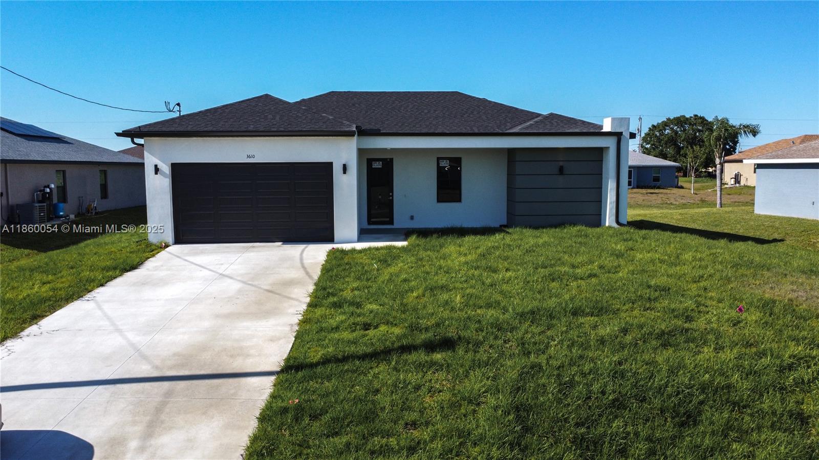 Modern 3/2.5 in Lehigh Acres! New build, open layout, impact windows, no HOA. Move-in ready—schedule your showing today!