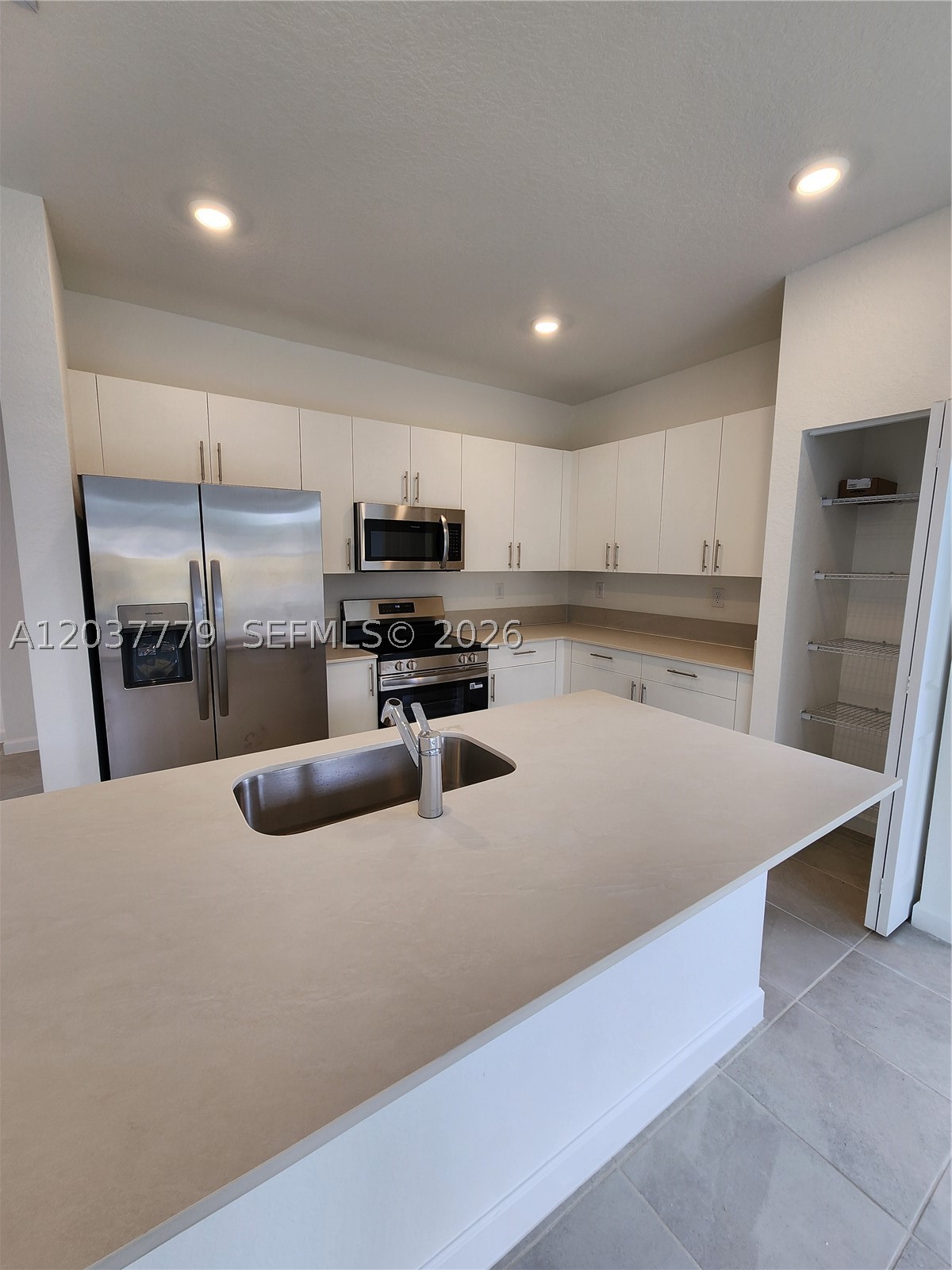 Beautiful 3-bedroom, 3-bathroom corner townhouse for rent in a brand-new community. This spacious corner unit offers added privacy with no neighbors on one side. Features include a private patio, in-unit washer and dryer, brand-new appliances, and a modern open-concept layout. One full bedroom and bathroom on the first floor. The property comes with two assigned parking spaces plus ample guest parking throughout the community. Conveniently located next to Publix and close to schools, shopping centers, restaurants, and major roadways, including the Florida Turnpike exit. Enjoy comfortable living in a growing neighborhood with easy access to everything you need. Move-in ready!