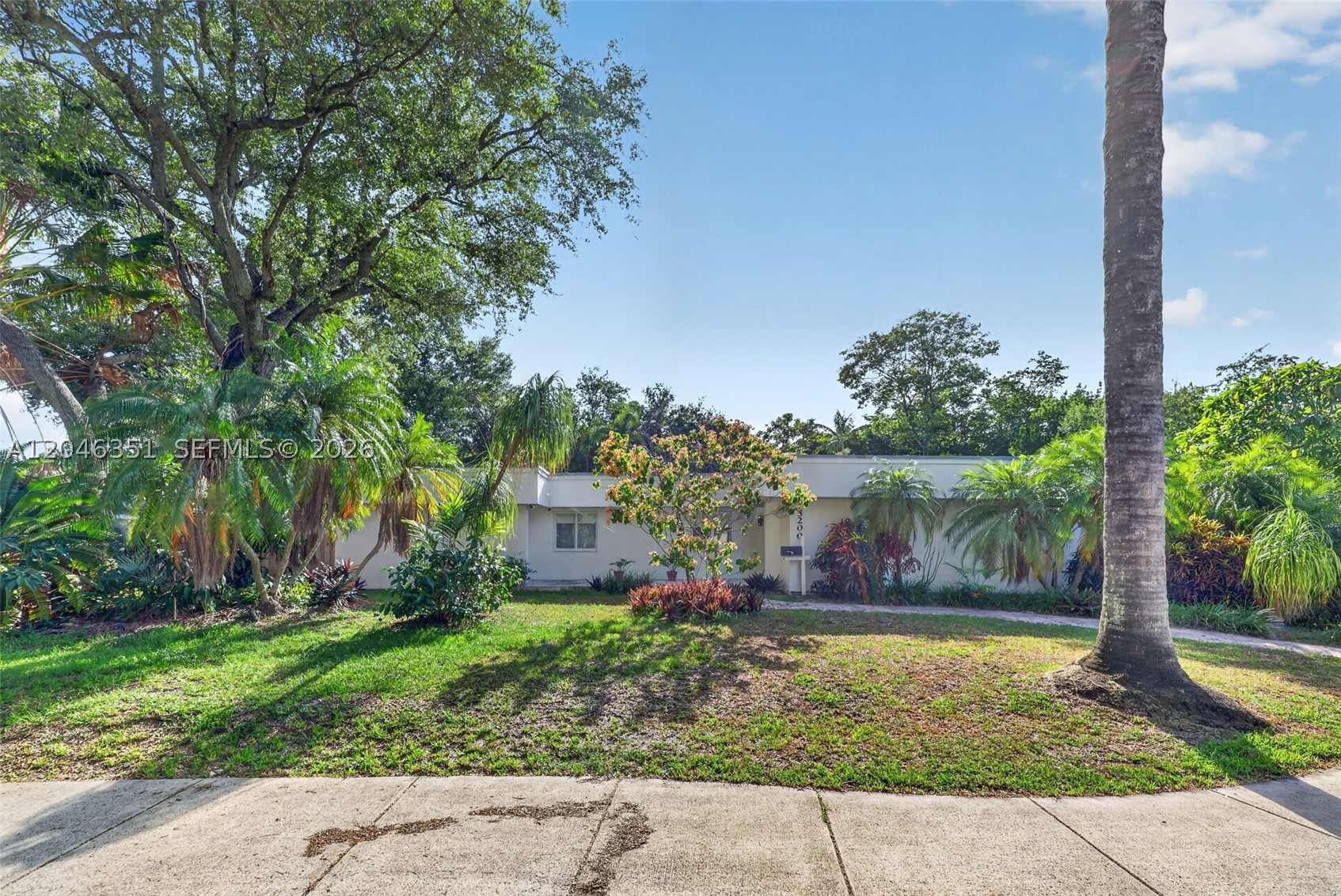 Beautifully updated 4-bedroom, 3-bath open-concept home ideally located near Coral Reef Park and top-rated schools. This spacious residence features two primary suites, both with direct access to the pool area, perfect for guests or multigenerational living. Upgrades include new A/C, updated PBC plumbing, new flooring, and a remodeled kitchen. Outdoor living shines with marble decking, screened pool enclosure, outdoor kitchen connections, and a gas-heated saltwater pool. Additional highlights include impact windows, generator hookup, surround sound in the primary suite, and an outdoor shower.
