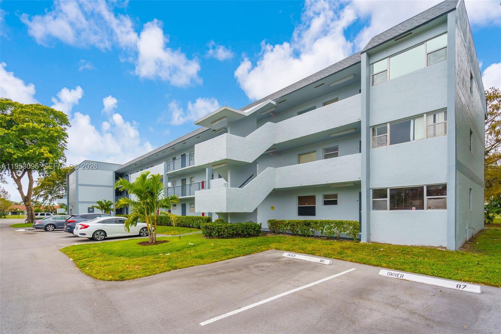 Nestled in the highly desirable Sands Point Phase V community & located directly across from the community pool. This bright, upgraded first-floor corner residence offers 2 bedrooms & 2 bathrooms with a desirable split floor plan. Conveniently situated, it combines comfort, style, and practicality. Tastefully modernized primary bathroom, with all components recently replaced. Enjoy tranquil views of the walking path from your screened terrace, perfect for relaxing. The living room flows seamlessly into the formal dining area, while the remodeled eat-in kitchen is both stylish & functional, featuring cherry wood cabinetry, granite countertops, & stainless steel appliances. A generous primary suite with a walk-in closet. This all-ages community provides resort-style amenities. The monthly condo fee includes pest control, high-speed internet, water, & sewer. Residents enjoy access to a heated pool, fitness center, tennis court, clubhouse, & extra storage. The building has new roofs, a new laundry facility & elevators. It is freshly painted, a concrete restoration, a repaved & painted parking lot, & upgraded landscaping. An assigned parking space is conveniently located directly in front of the unit entrance & a 2nd one may be available with the association. Rentals are permitted after two years of ownership. Near shopping, the world-famous Sawgrass Mills Mall, & just a short drive east to the sun & sand of Fort Lauderdale Beach.